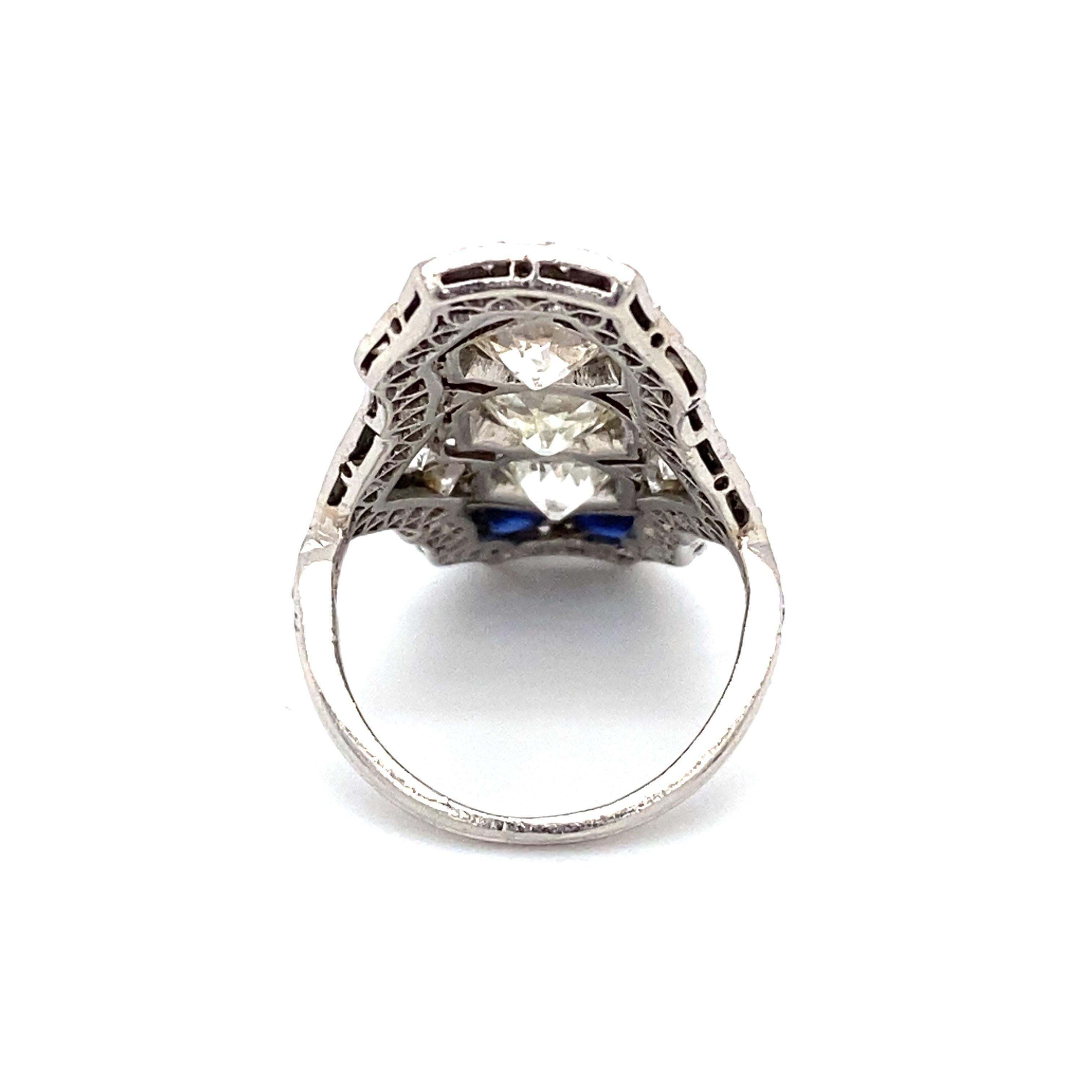 Old European Cut Circa 1920s Art Deco 5.5 Carat Diamond and Sapphire Shield Ring in Platinum