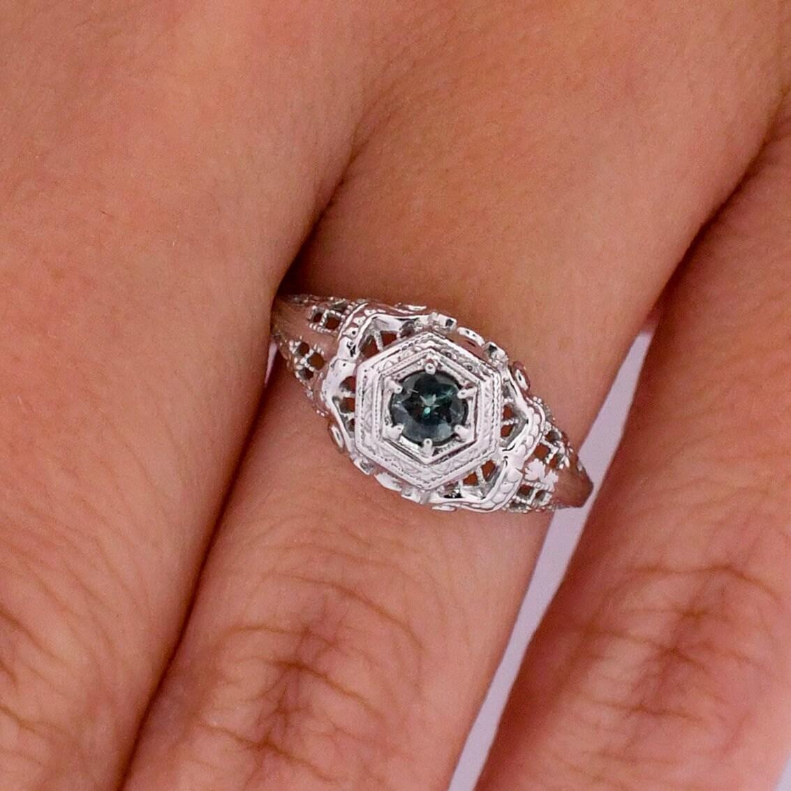 Circa 1920s Art Deco .68Ct Natural Alexandrite 18K White Gold Filigree Solitaire In Good Condition In Addison, TX