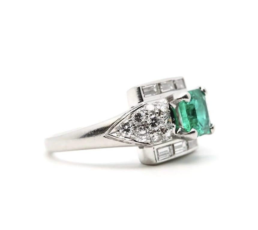 Aston Estate Jewelry Presents:

A spectacular Art Deco Colombian emerald, and diamond ring in platinum. Featuring a 1.30 carat old Muzo Colombian emerald of beautiful rich vivid green color with only light jardin. A trio of baguette cut diamonds