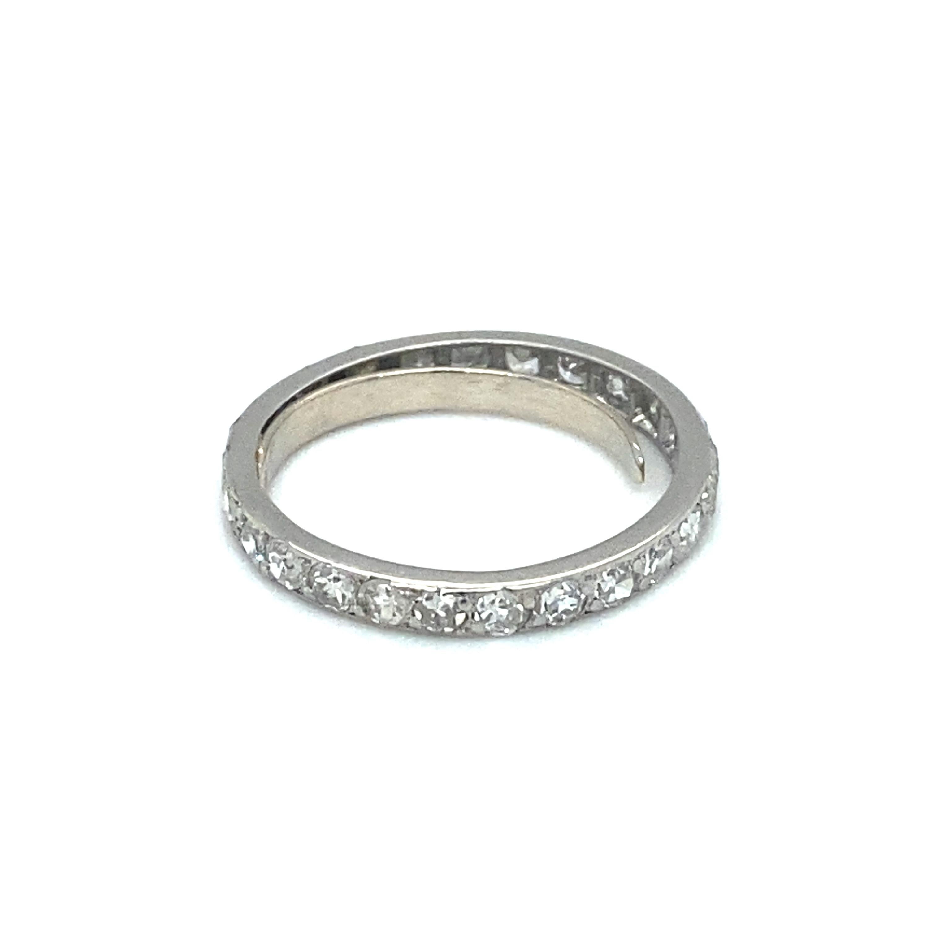 Item Details: This ring features sparkling single cut diamonds all around that total 1 carat. It dates back to the 1920s, art deco era and has a timeless eternity band design. There is a sizing spring insert that can be removed upon request.