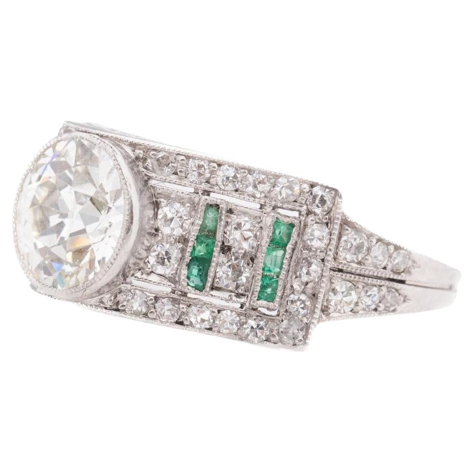 Circa 1920s Art Deco Emerald and Old European Diamond Engagement Ring For Sale