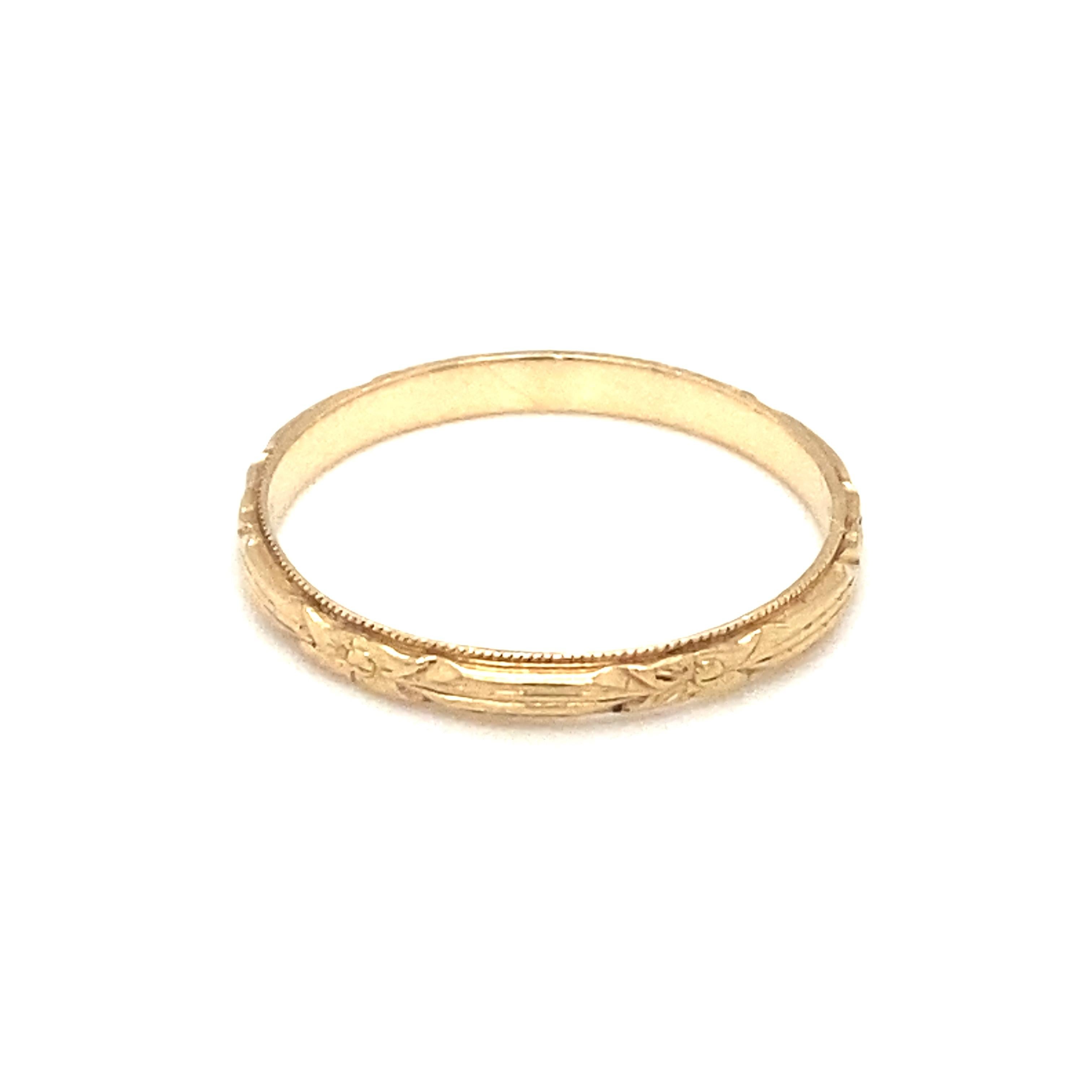 Item Details: This simple art deco wedding band from the 1920s has a geometric floral design etched into it.

Circa: 1920s
Metal Type: 14 karat yellow gold
Weight: 1.2 grams
Size: US 6