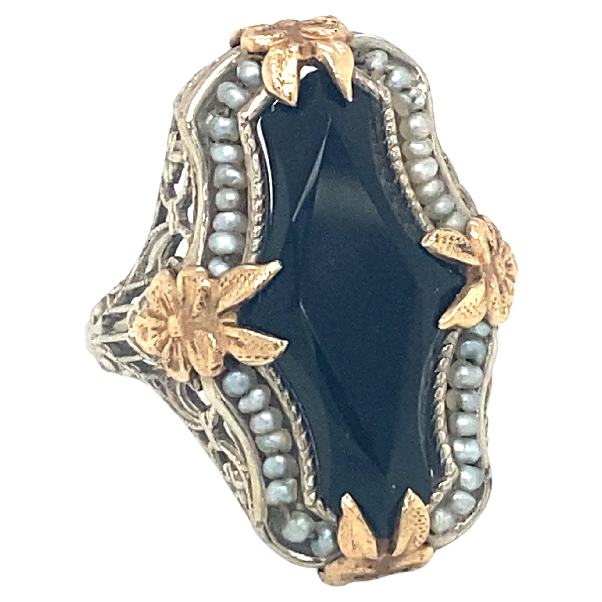 Circa 1920s Art Deco Onyx and Pearl Ring in Two Tone 14K Gold For Sale