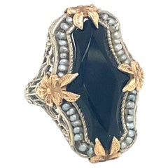 Circa 1920s Art Deco Onyx and Pearl Ring in Two Tone 14K Gold