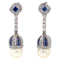 Circa 1920s Art Deco Pearl, Diamond and Sapphire Dangle Earrings in Platinum