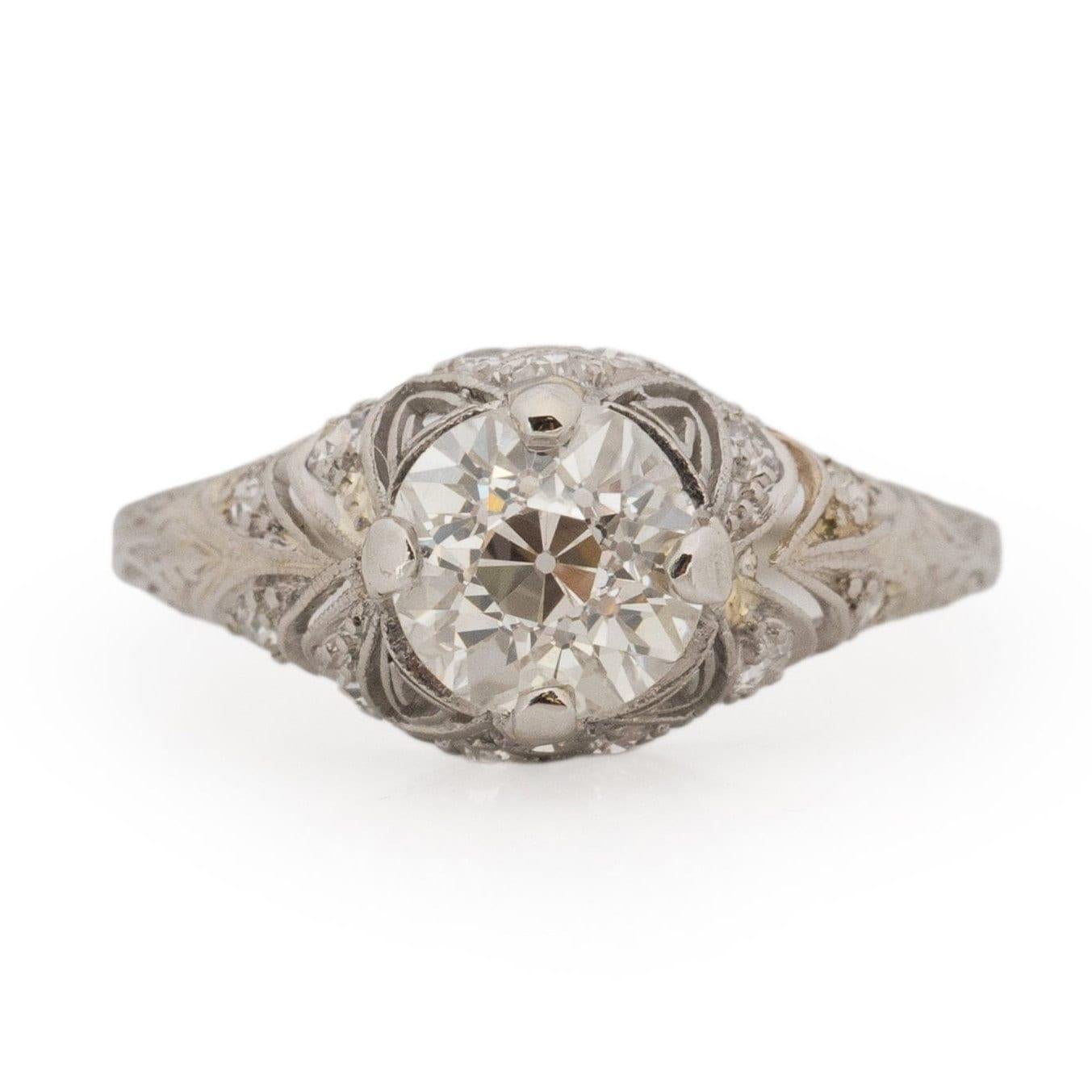 Transporting you to the Art Deco era, this exquisite piece embodies the geometric elegance reminiscent of the great Gatsby era. Meticulously fashioned in platinum, a solitaire old European cut diamond graces the pinnacle of an elegant cathedral