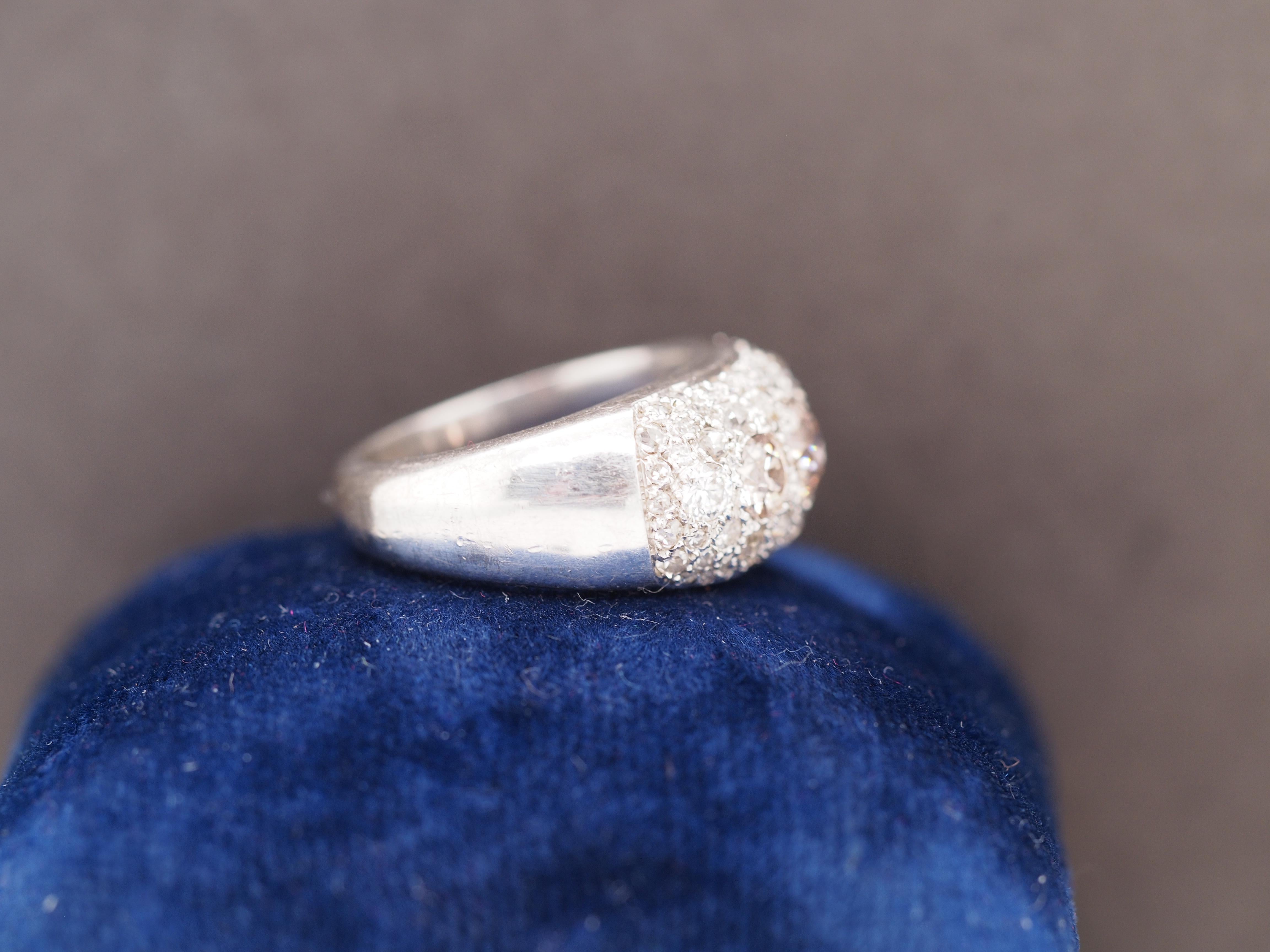 Year: 1930s
Item Details:
Ring Size: 7
Metal Type: Platinum [Hallmarked, and Tested]
Weight: 9.8 grams
Diamond Details:
Center Diamond: .50ct, Old Mine Brilliant, Fancy Brown, VS Clarity, Natural Diamond, Natural Color
Side Stone Details: 1.00ct