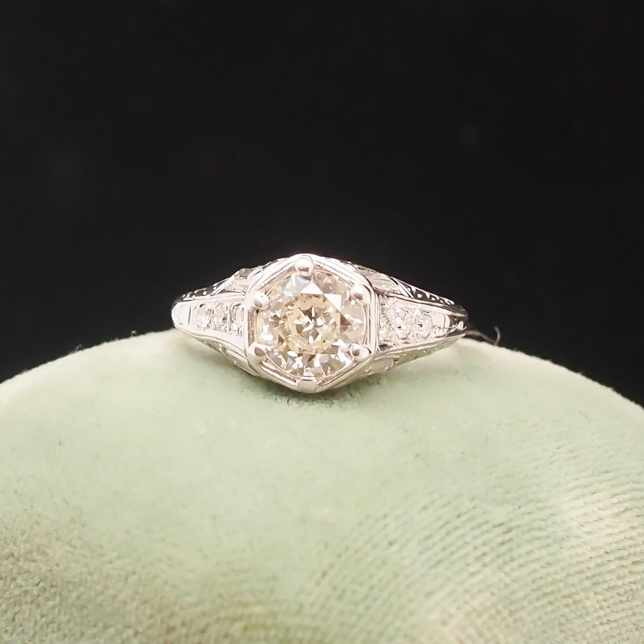 Year: 1920s
Item Details:
Ring Size: 5 (Sizable)
Metal Type: Platinum [Hallmarked, and Tested]
Weight: 3.1 grams
Center Diamond Details: .90ct, Old European Brilliant, L Color, VS Clarity, Natural Diamond
Side Diamond Details: .20ct total weight,