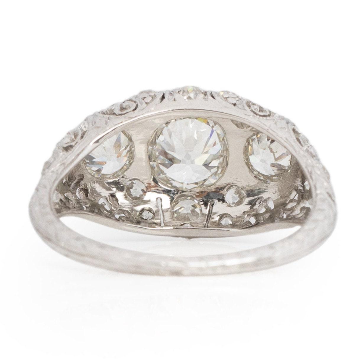 Women's Circa 1920's Art Deco Platinum Filigree Old European Cut 3-Stone Diamond Ring For Sale