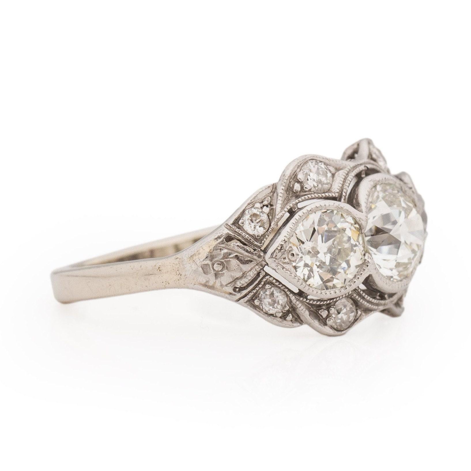 Circa 1920's Art Deco Platinum GIA Certified Three Stone Old European Cut Ring In Good Condition For Sale In Addison, TX