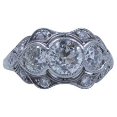 Antique Circa 1920's Art Deco Platinum GIA Certified Three Stone Old European Cut Ring