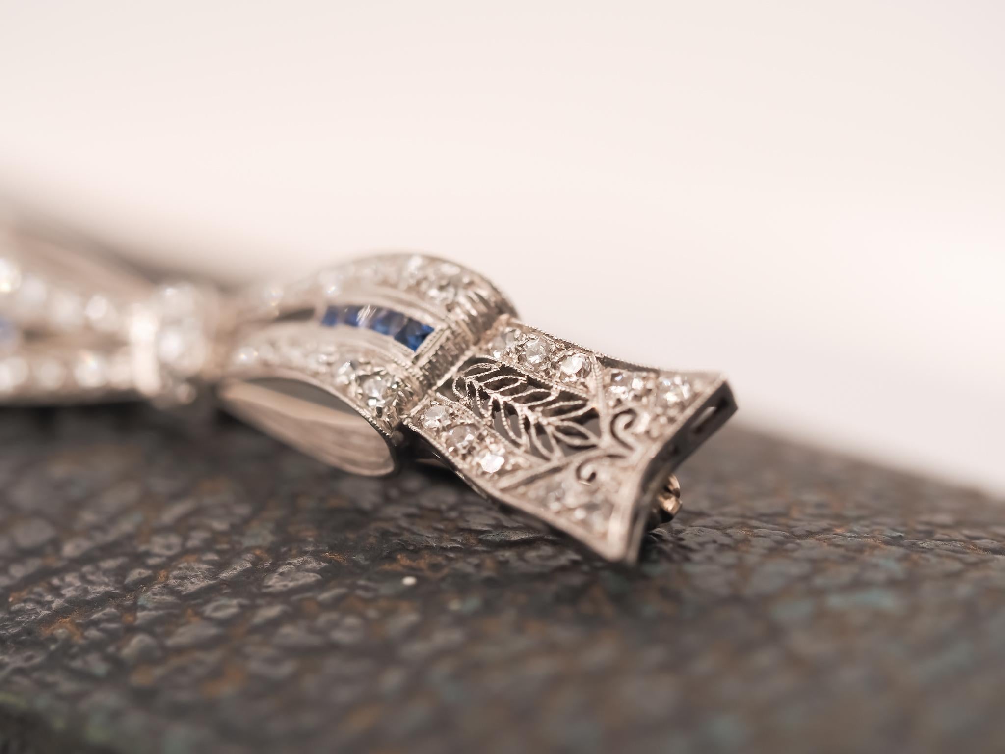 Circa 1920s Art Deco Platinum Sapphire and Diamond Ribbon Brooch For Sale 1