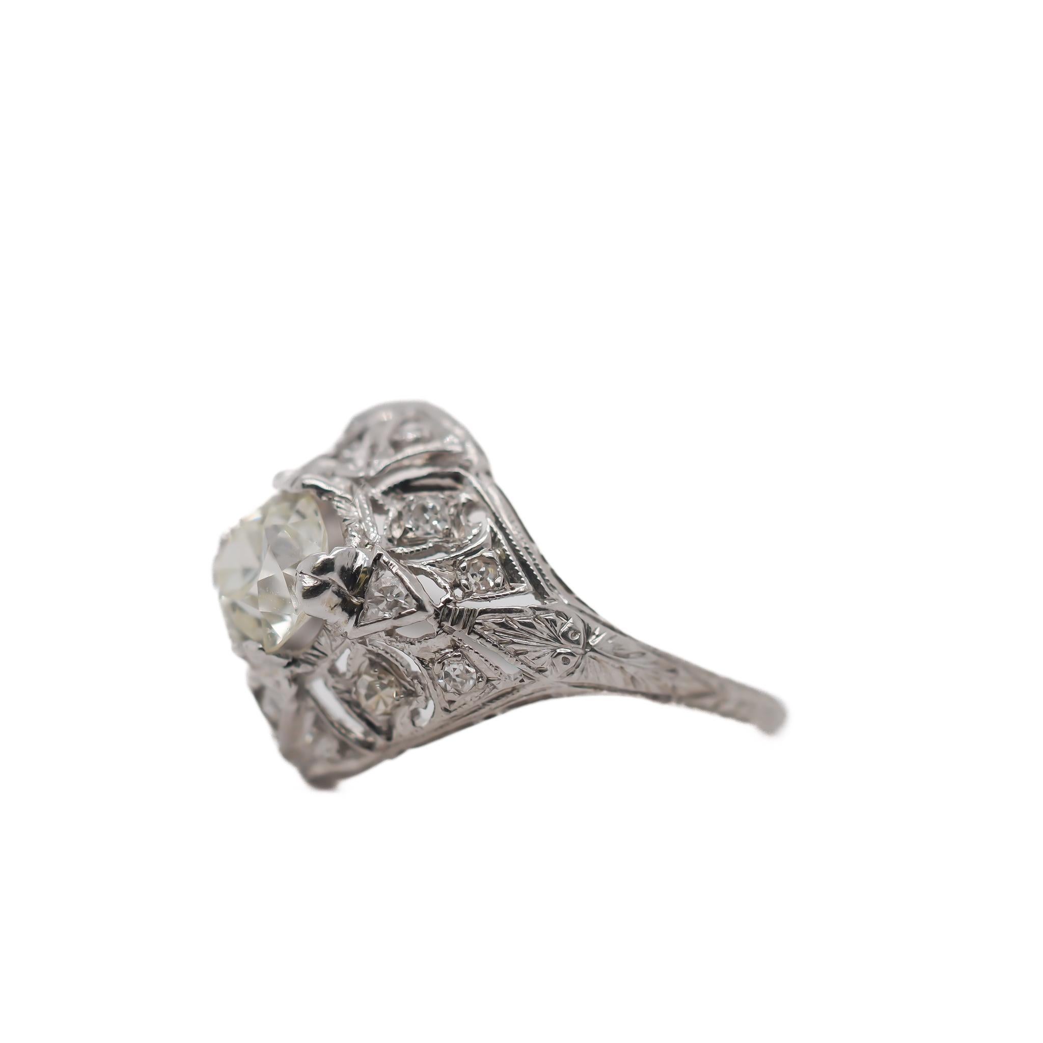 Year: 1920s

Item Details:
Ring Size: 7.25
Metal Type: Platinum [Hallmarked, and Tested]
Weight: 4.3 grams

Center Diamond Details:

GIA Report#: 2235353896
Weight: 1.08ct total weight
Cut: Old European brilliant
Color: M
Clarity: VVS2
Type: