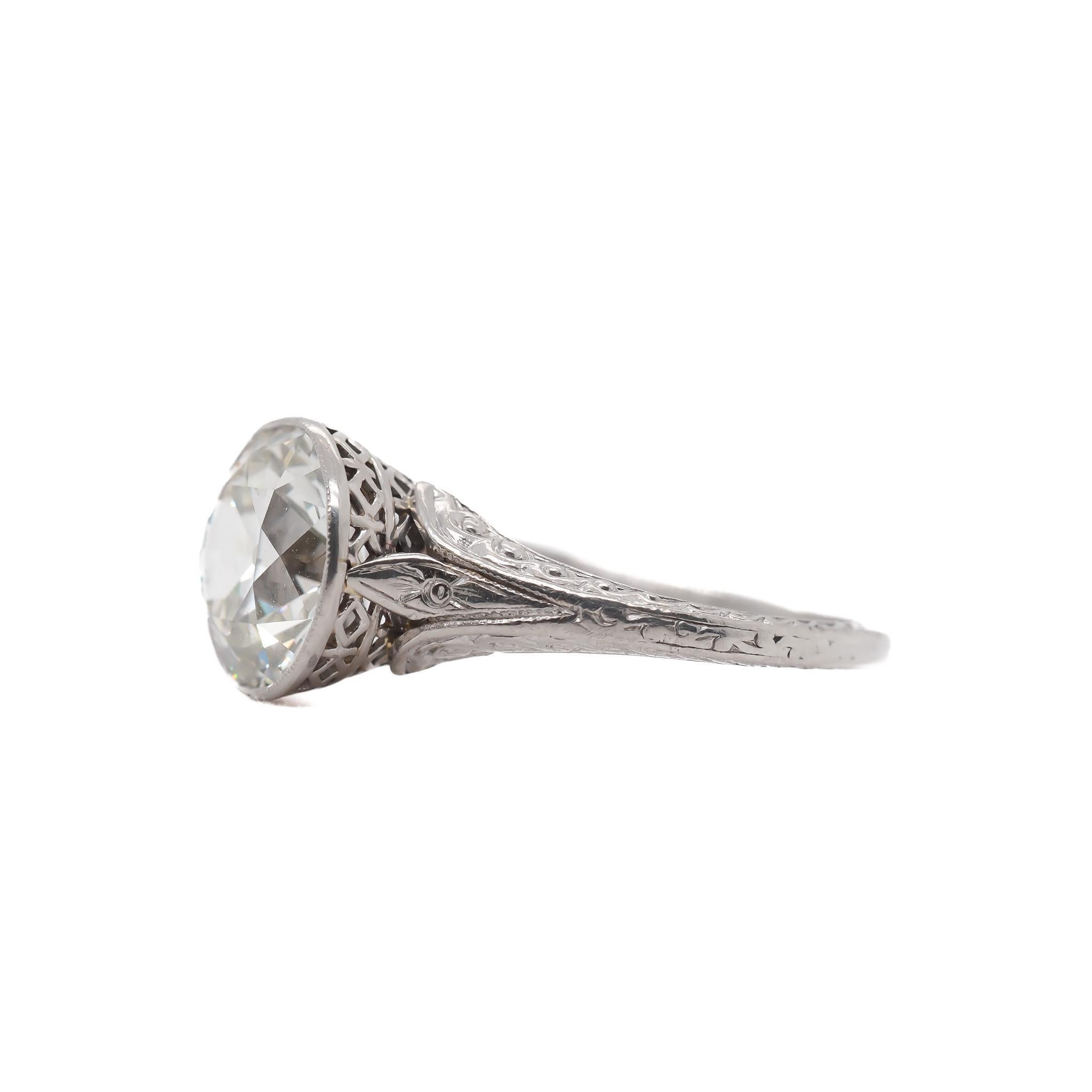 Year: 1920s

Item Details:
Ring Size: 6.25
Metal Type: Platinum [Hallmarked, and Tested]
Weight: 4.1 grams

Center Diamond Details:

GIA Report#: 2235467044
Weight: 2.58ct total weight
Cut: Old European brilliant
Color: M
Clarity: SI1
Type:
