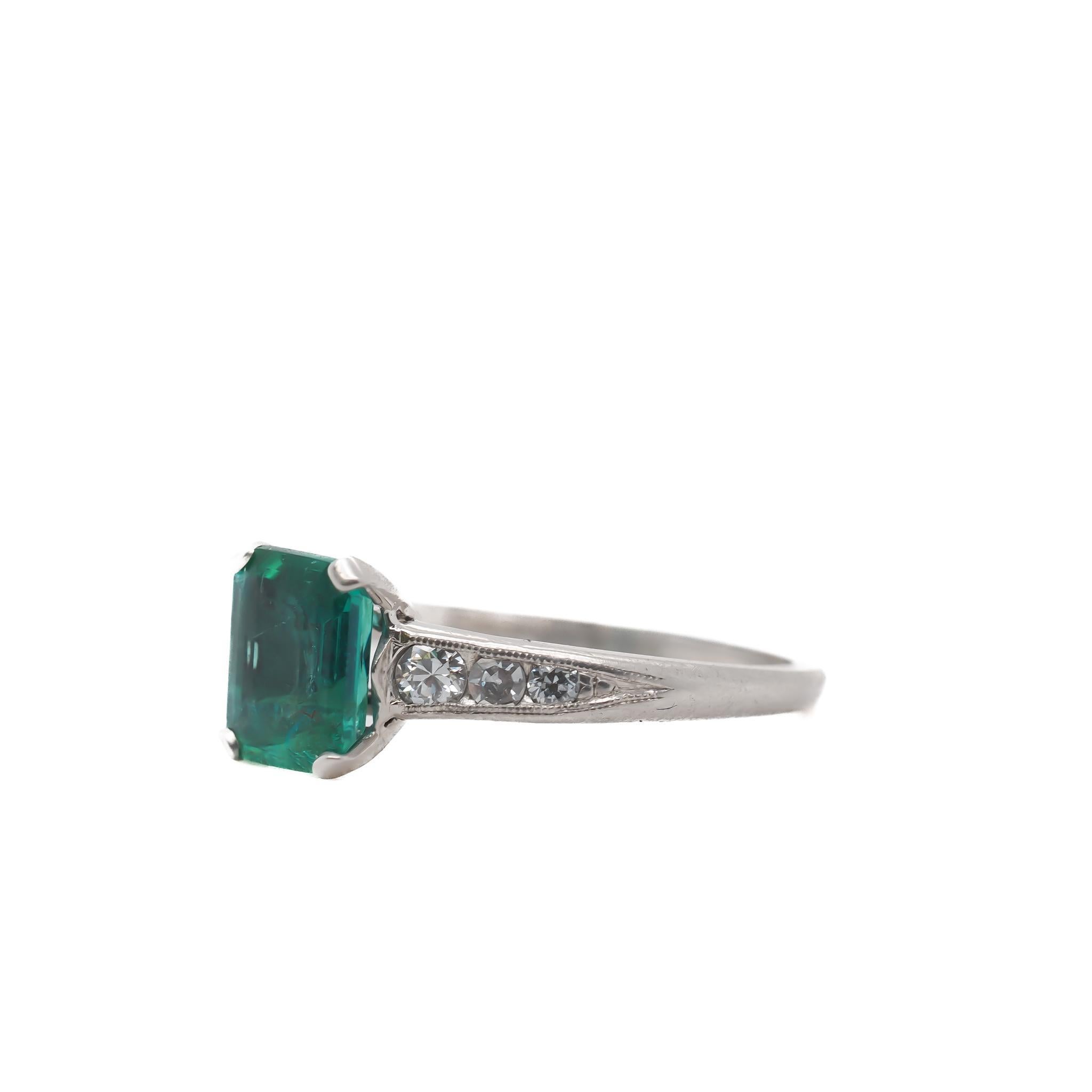 Circa 1920s Platinum Art Deco Emerald and Diamond Engagement Ring - VEG#43a

Item Details:
Year: 1920s
Ring Size: 5.75
Metal Type: Platinum [Hallmarked, and Tested]
Weight: 2.9 grams

Center Emerald Details:
Weight: 1.25 ct total weight
Cut: