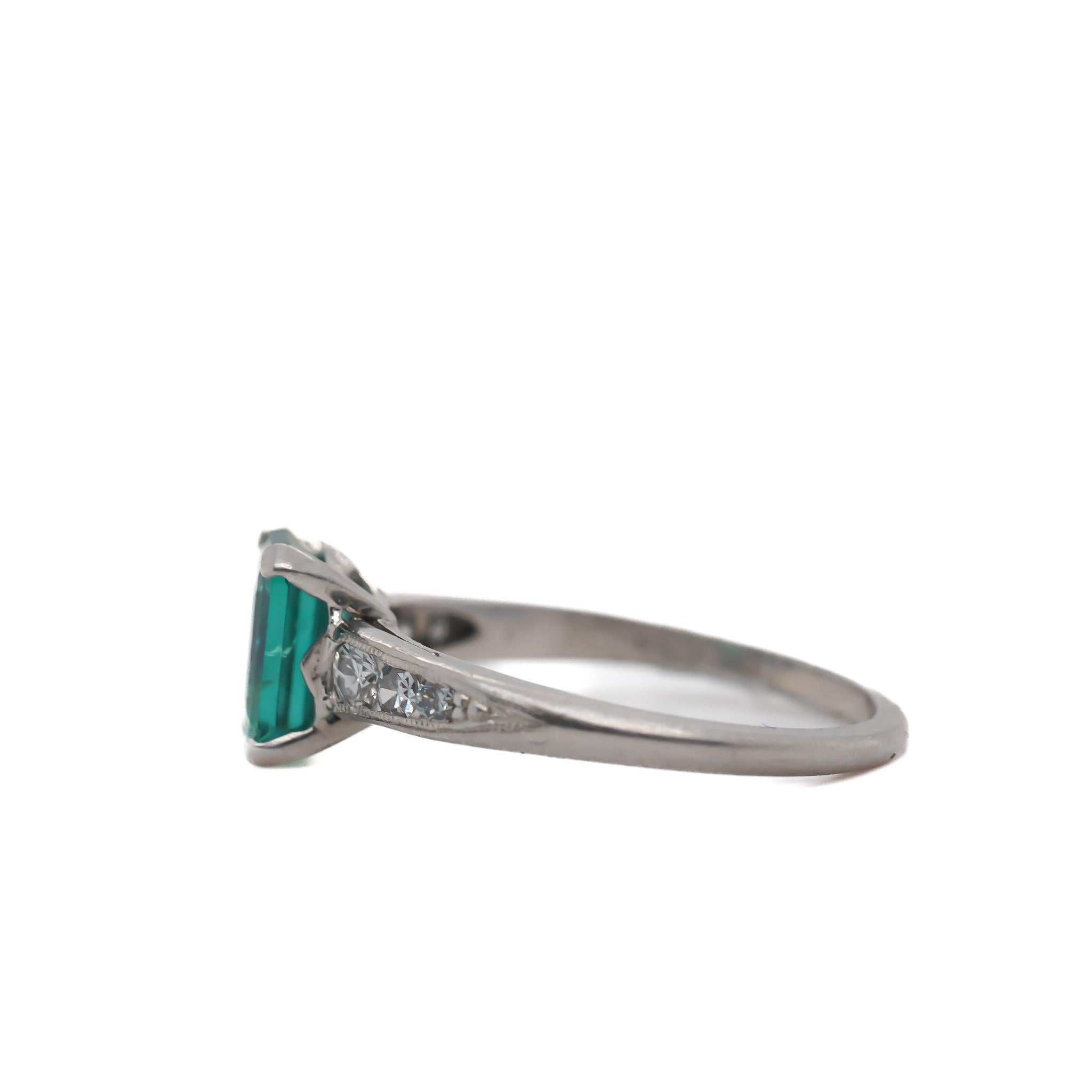Circa 1920s Platinum Art Deco Emerald and Diamond Engagement Ring In Good Condition For Sale In Hicksville, NY