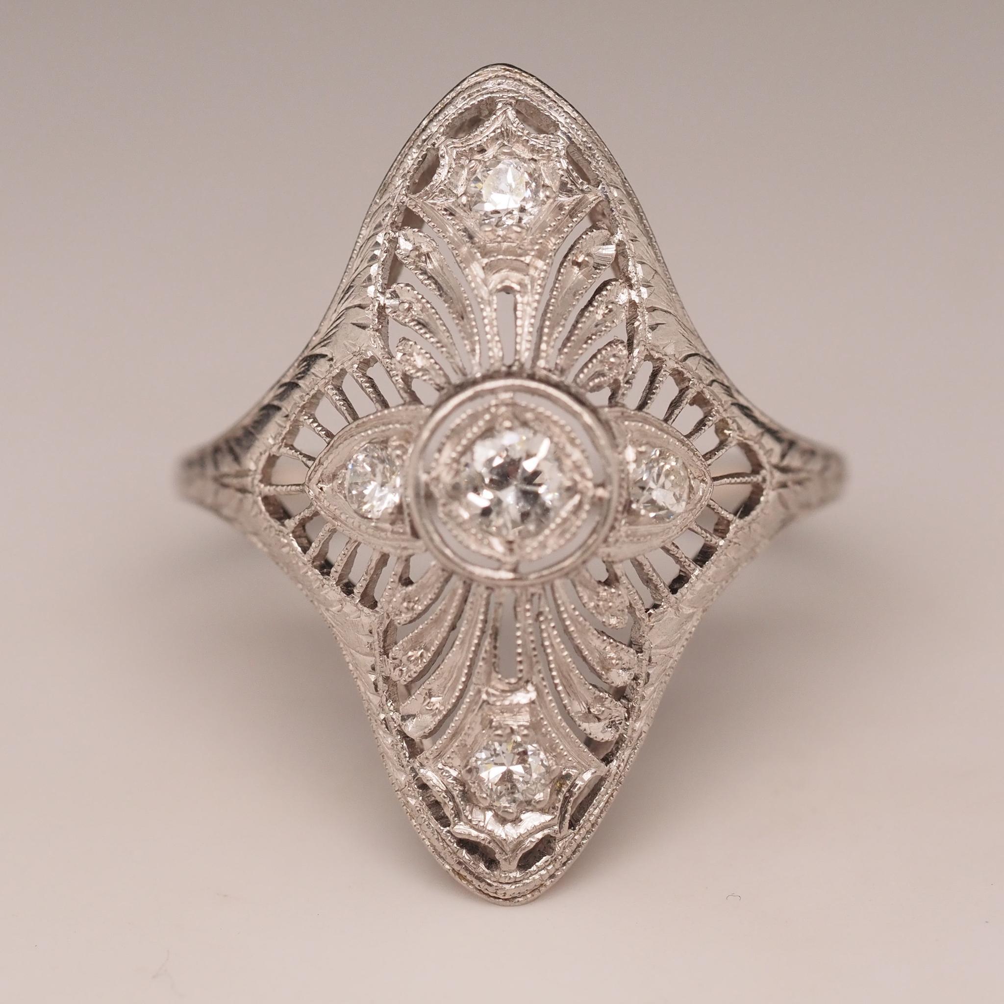 Year: 1920s
Item Details:
Ring Size: 9.5 (Sizable)
Metal Type: Platinum [Hallmarked, and Tested]
Weight: 5.5 grams
Diamond Details: .25ct total weight, old European brilliant, F color, VS Clarity
Band Width: 1.5mm
Condition: Excellent