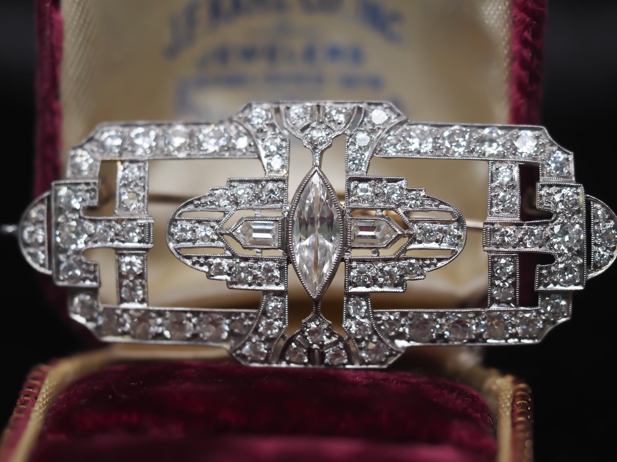 Year: 1920s
Item Details:
Metal Type: Platinum [Hallmarked, and Tested]
Weight: 10.5 grams
Diamond Details: Center antique marquise is 1.00ct, F color and VS clarity. Surrounding diamonds weight approximately 2.50ct and are bullet step cuts and old