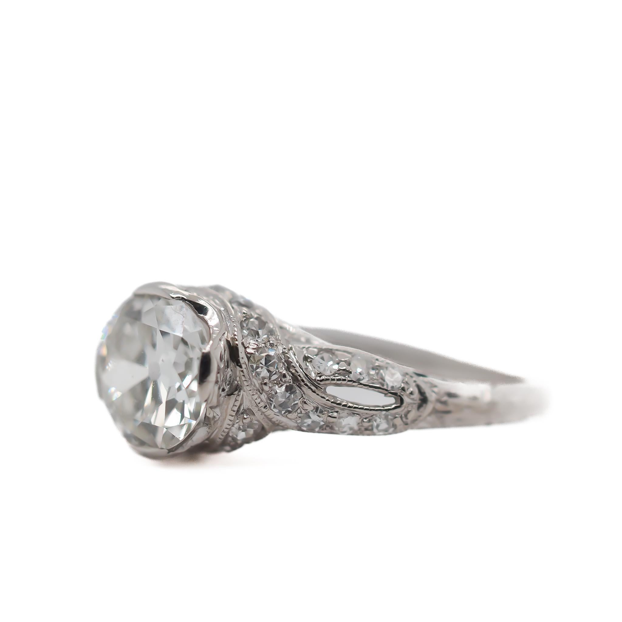 Year: 1920s

Item Details:
Ring Size: 6
Metal Type: Platinum [Hallmarked, and Tested]
Weight: 3.3 grams

Center Diamond Details:

GIA Report#: 2235480037
Weight: 1.25 ct total weight
Cut: Old European brilliant
Color: I
Clarity: VS1
Type: