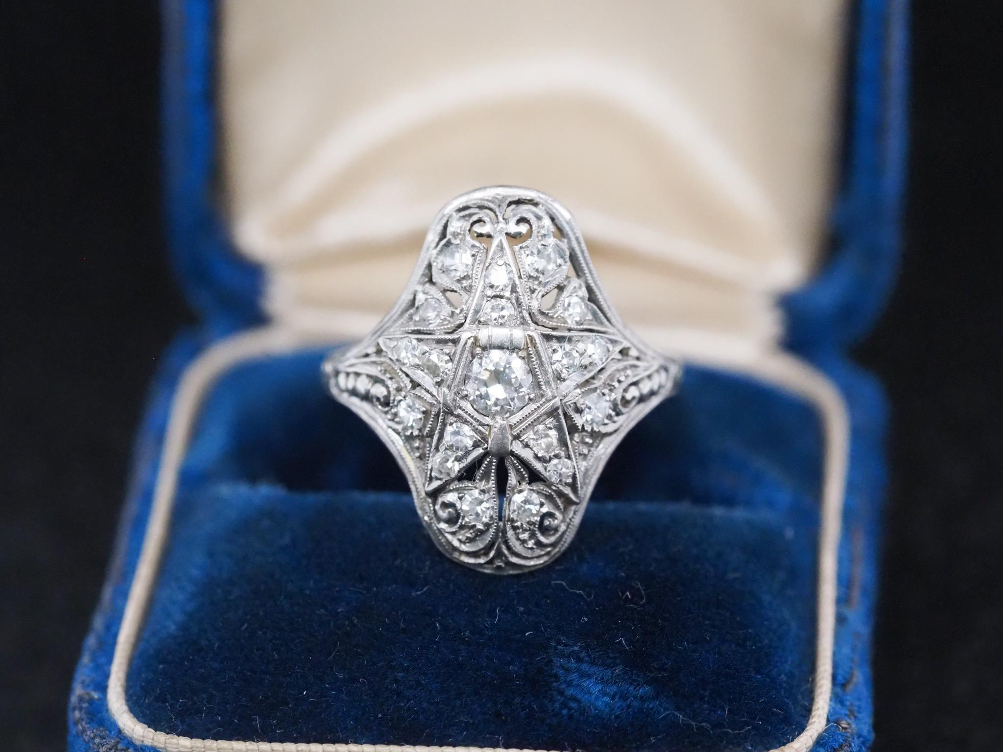 Year: 1920s
Item Details:
Ring Size: 6.5 (Sizable)
Metal Type: Platinum  [Hallmarked, and Tested]
Weight:  3.7 grams
Inner Shank Engraved: “Plymouth Chapter 423 BIC-PM”
Diamond Details: Old European Brilliant, Natural Diamonds, F Color, VS Clarity,