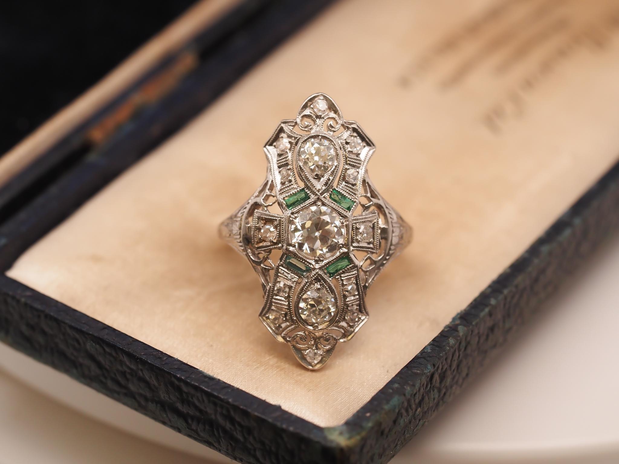 Year: 1920s
Item Details:
Ring Size: 7.5 (Sizable)
Metal Type: Platinum [Hallmarked, and Tested]
Weight: 5.2 grams
Center Diamond Details: .50ct, old European brilliant, F color, VS Clarity
Side Diamond Details: Old European Brilliant, .50ct total