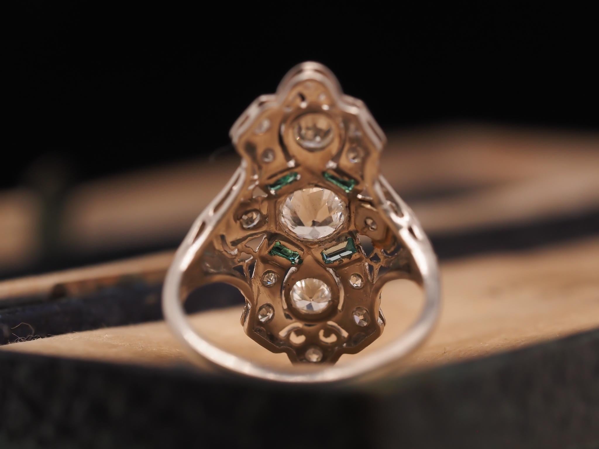 Circa 1920s Platinum Shield Ring with Old European Cut Diamond and Emeralds In Good Condition For Sale In Hicksville, NY