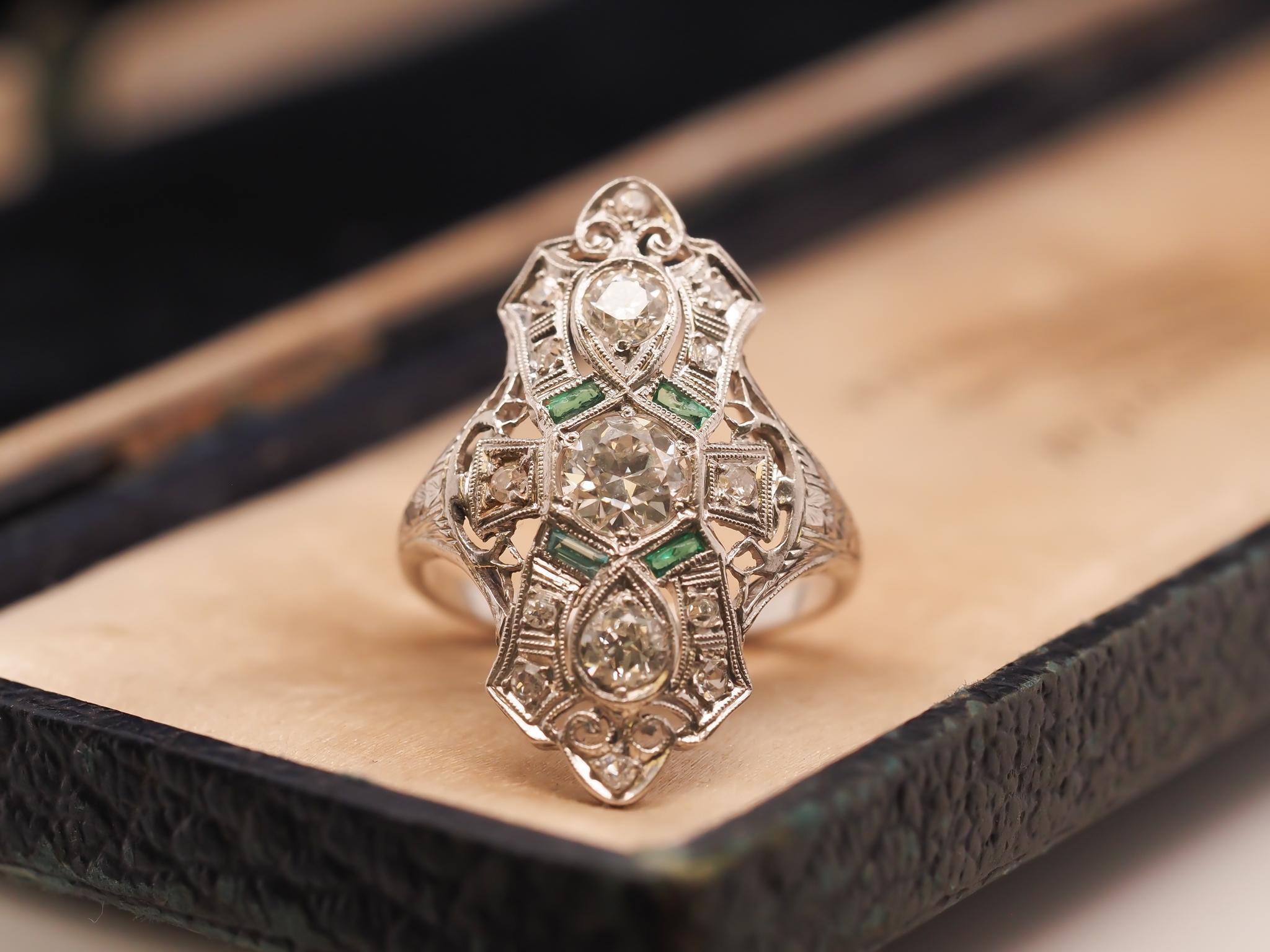 Circa 1920s Platinum Shield Ring with Old European Cut Diamond and Emeralds For Sale 1