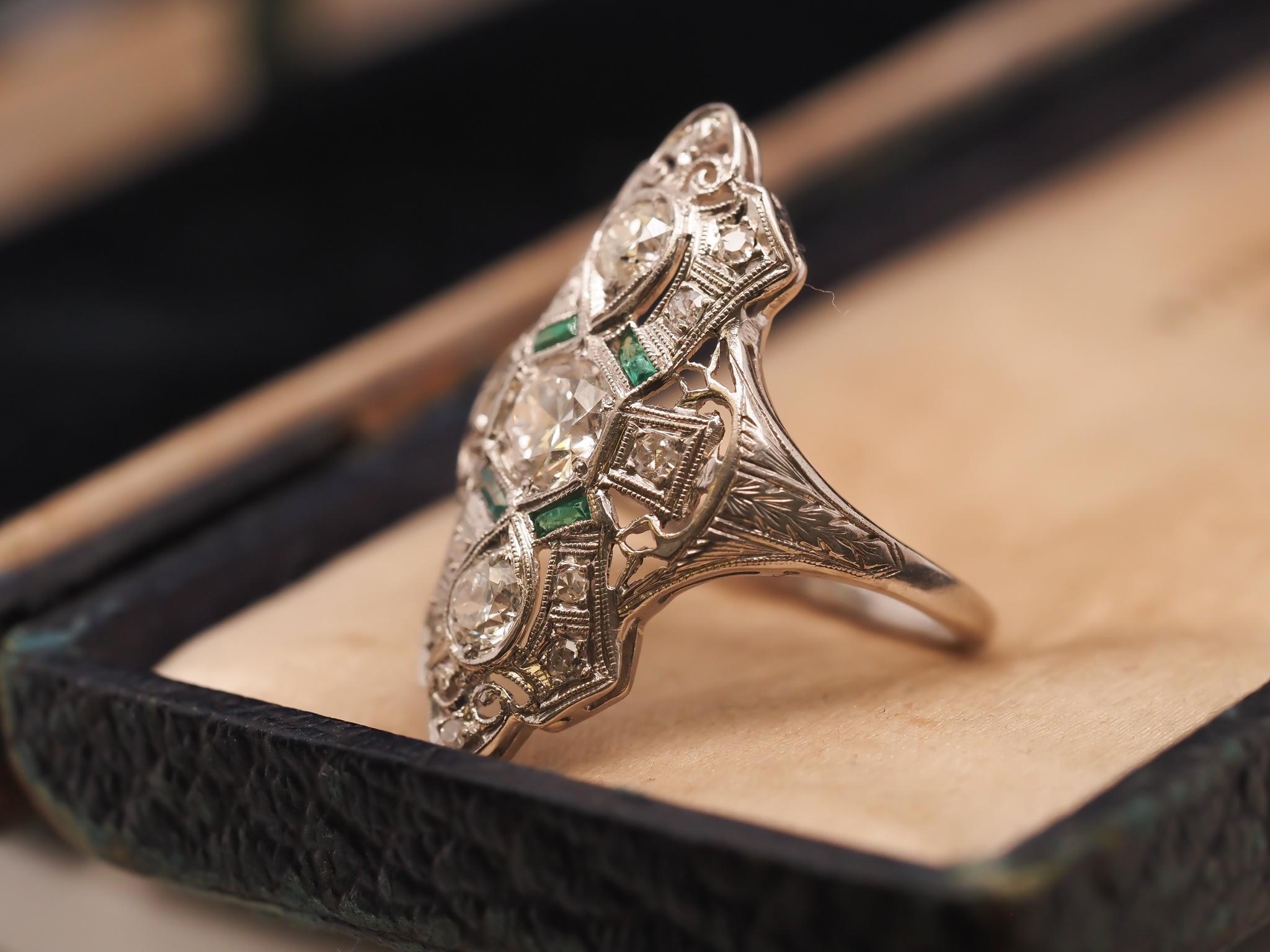 Circa 1920s Platinum Shield Ring with Old European Cut Diamond and Emeralds For Sale 2