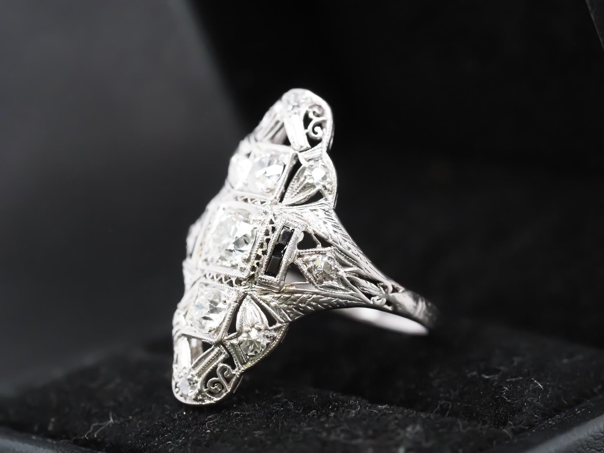 Year: 1920s
Item Details:
Ring Size: 8.25 (Sizable)
Metal Type: Platinum [Hallmarked, and Tested]
Weight: 4.8 grams
Center Diamond Details: .55ct, Old European Brilliant, F Color, VS Clarity.
Side Diamond Details: .70ct total weight, G Color, VS