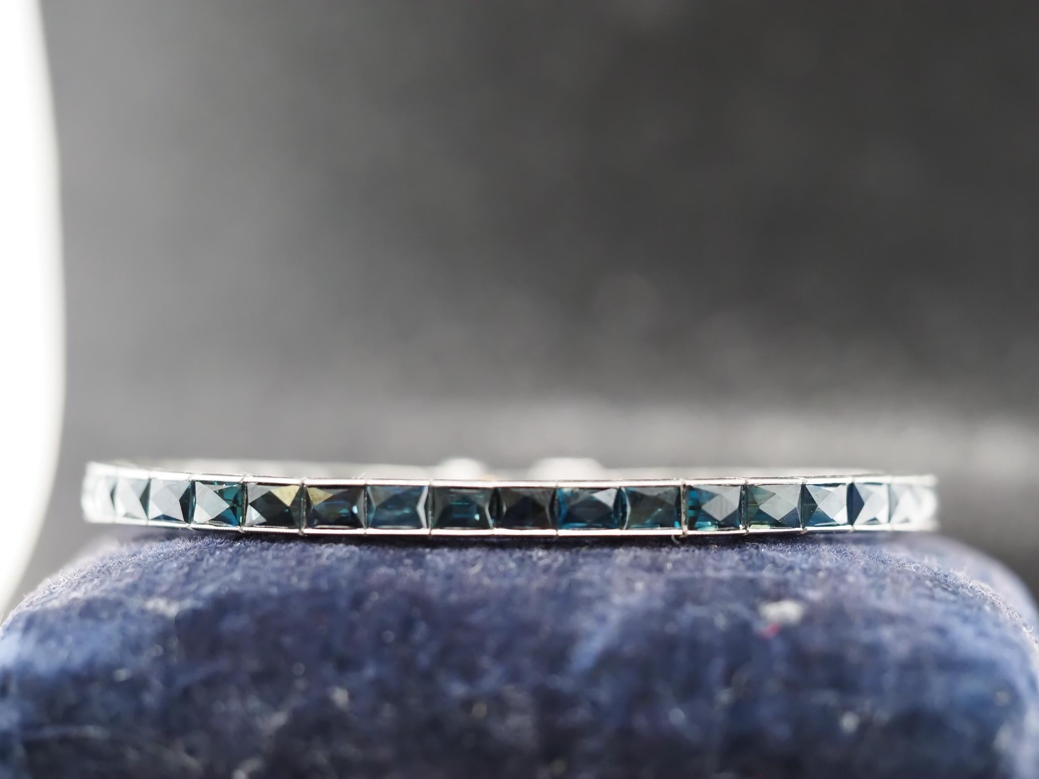 Year: 1921 (Has Patent number on the bracelet)

Maker: Oscar Heyman (Stamped with serial number)

Item Details:
Metal Type: Platinum with Gold Tounge [Hallmarked, and Tested]
Weight: 25.3 grams (All Items Total)

Stone Details: Natural, Sapphire (No