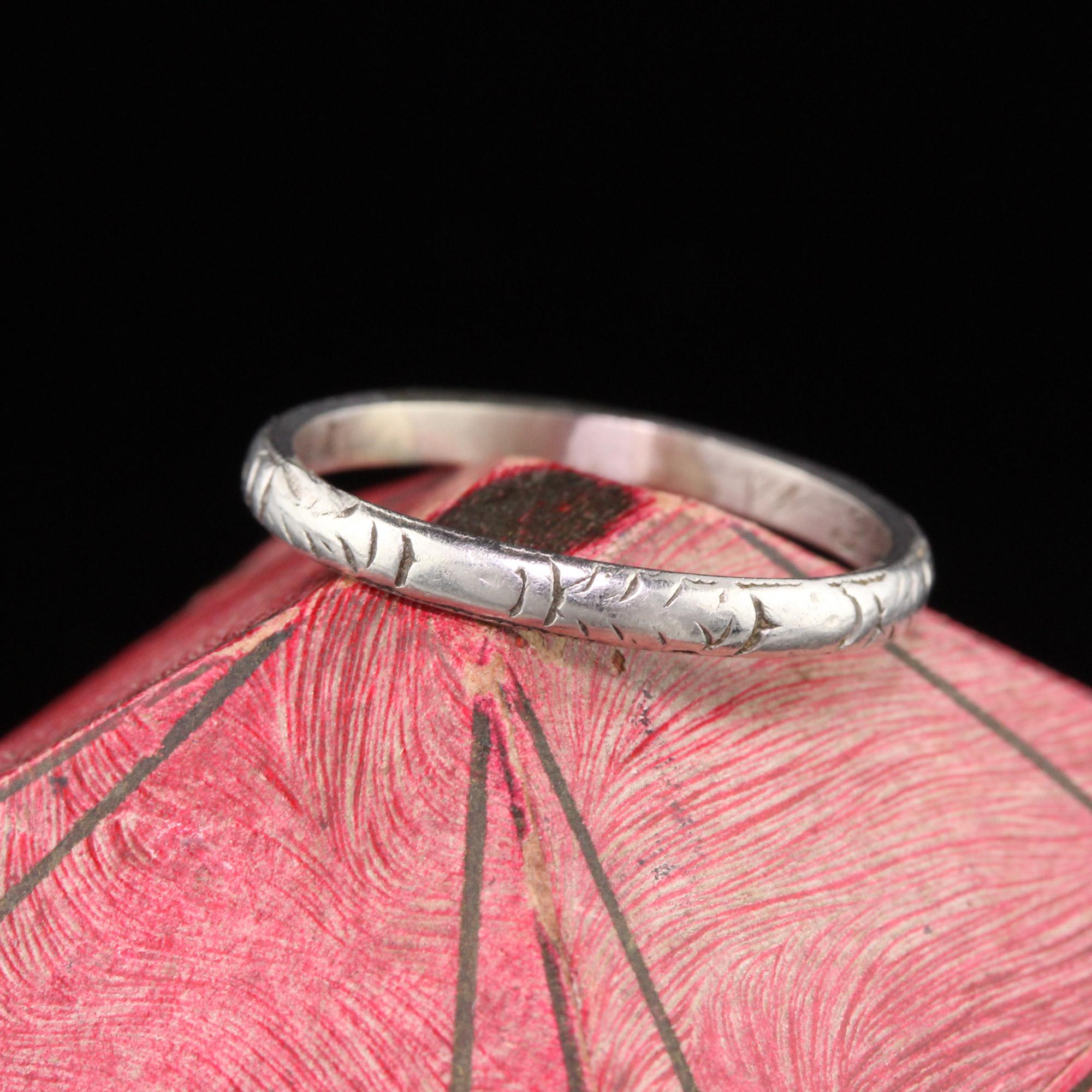 Unisex Art Deco Platinum Engraved Wedding Band with the engravings going all the way around. 

#R0229

Metal: Platinum

Weight: 3.1 Grams

Ring Size: 9

*Unfortunately this ring cannot be sized

Measurements: 2.36 mm wide

Measurement from finger to