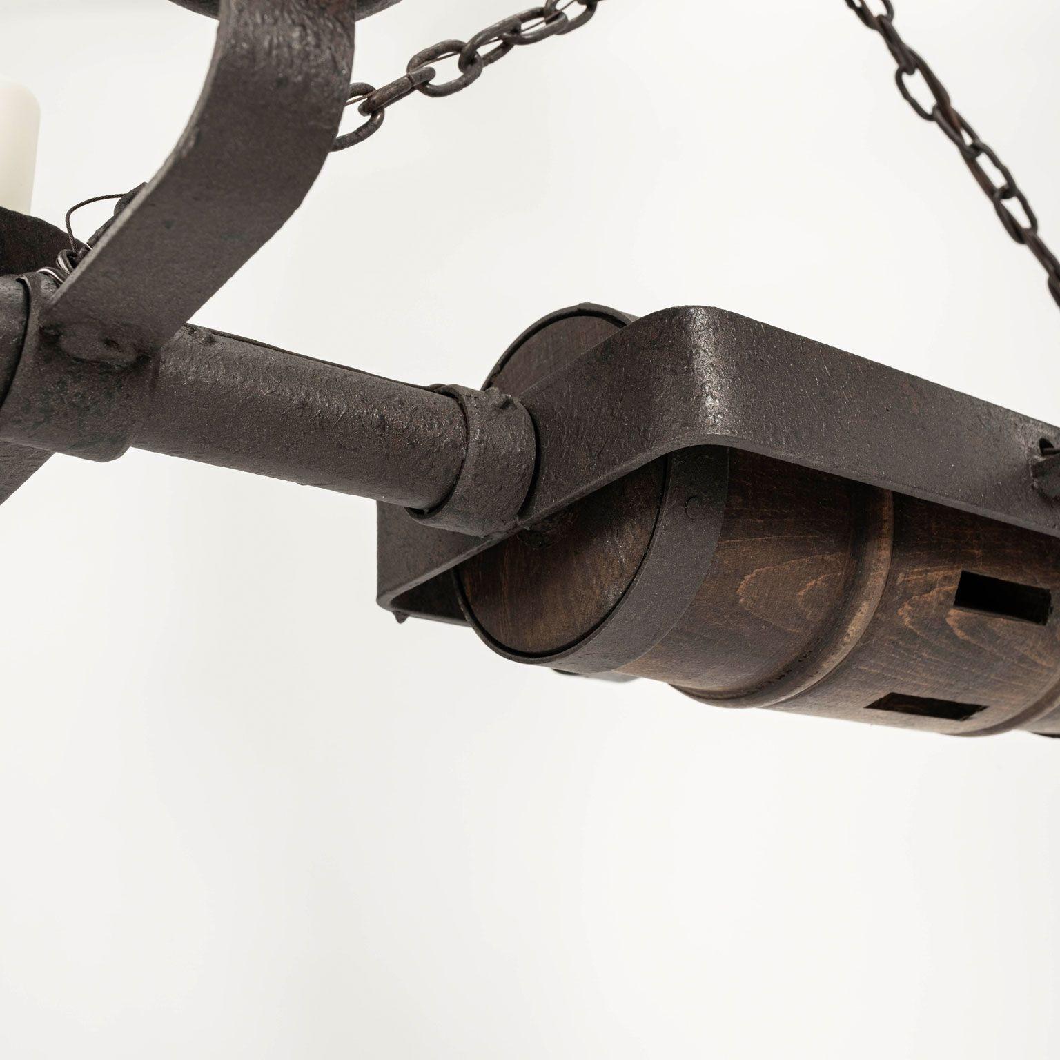 Circa 1930-1959 Rustic French Iron and Wooden Chandelier For Sale 9