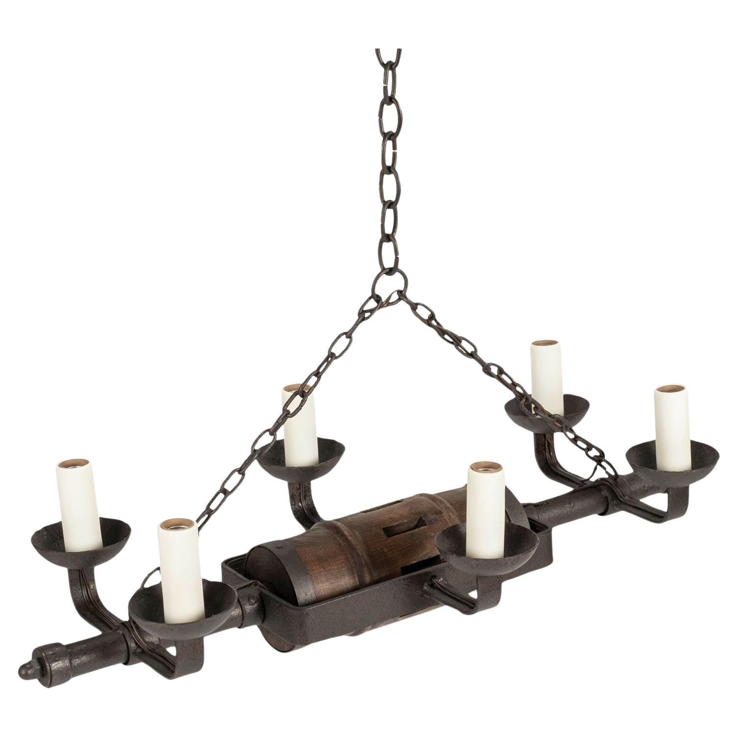 Circa 1930-1959 Rustic French Iron and Wooden Chandelier For Sale