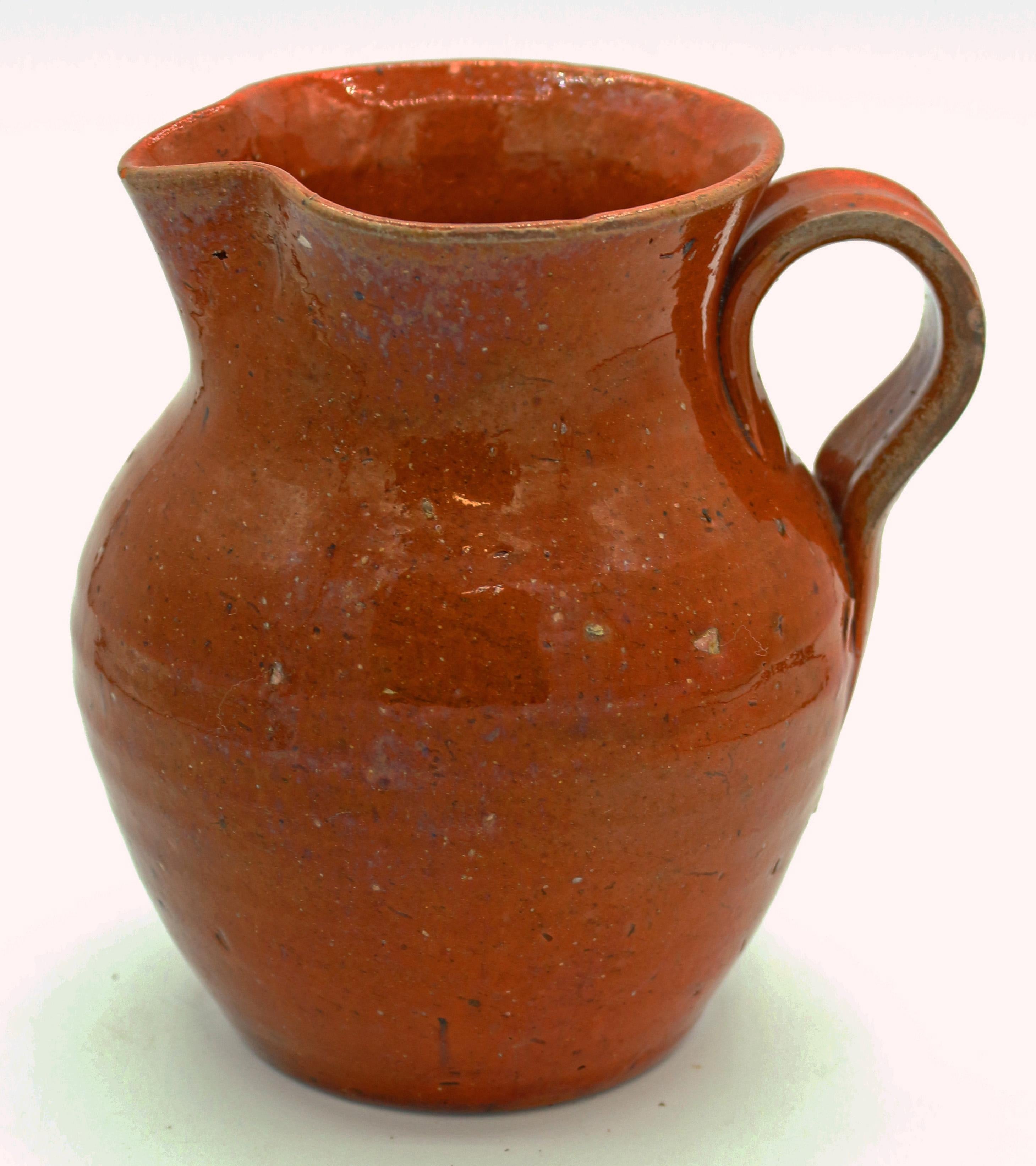 c.1930-50s pottery orange glazed pitcher with strap handle by Ben Owen I, Jugtown Ware, 1st Jugtown stamp. Minute 1/8