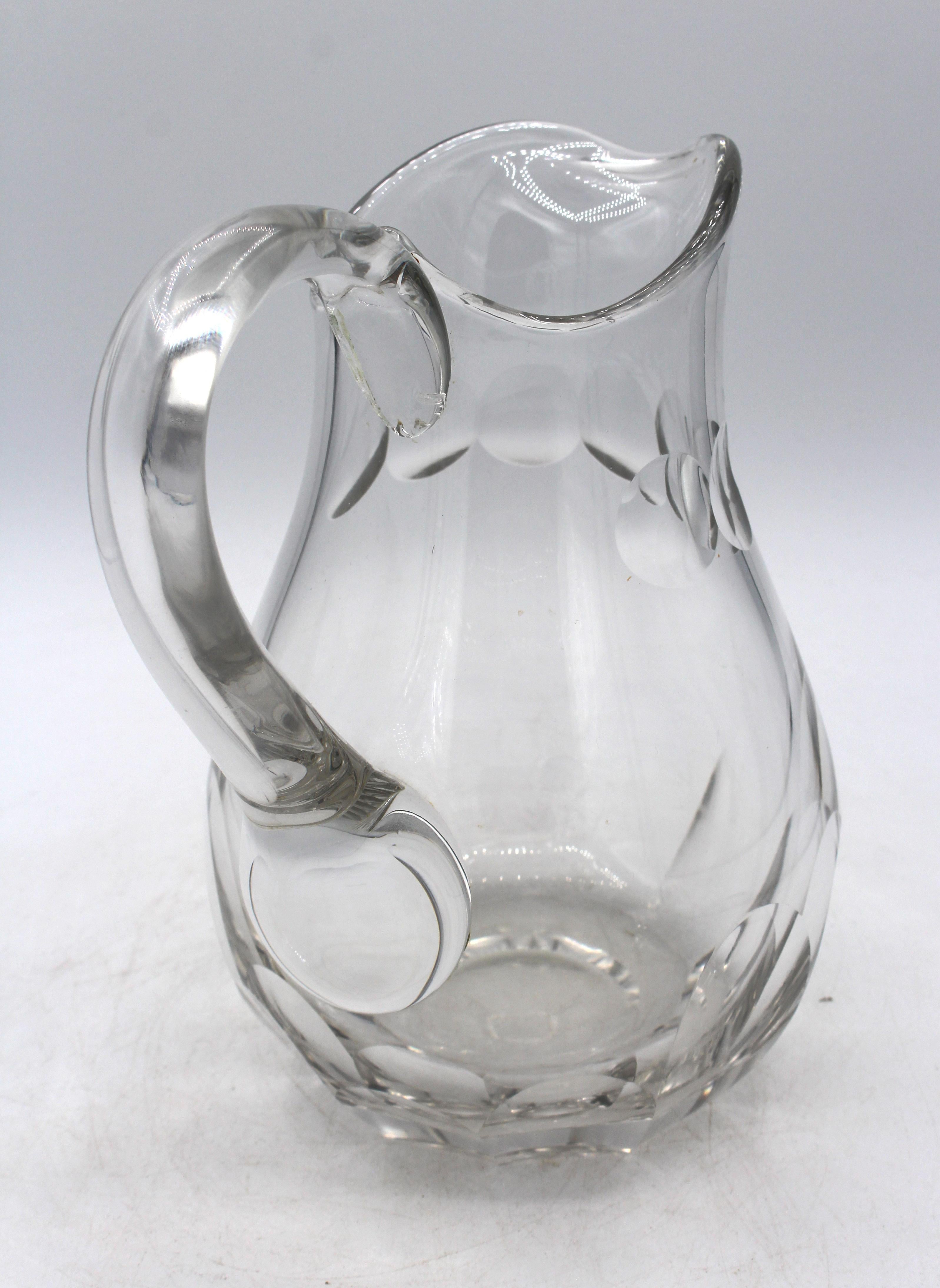 Circa 1930 lobe panel cut water pitcher, Continental. Circle cut neck panel & applied handle. From a Milanese wedding. Hand blown & cut. 7.75