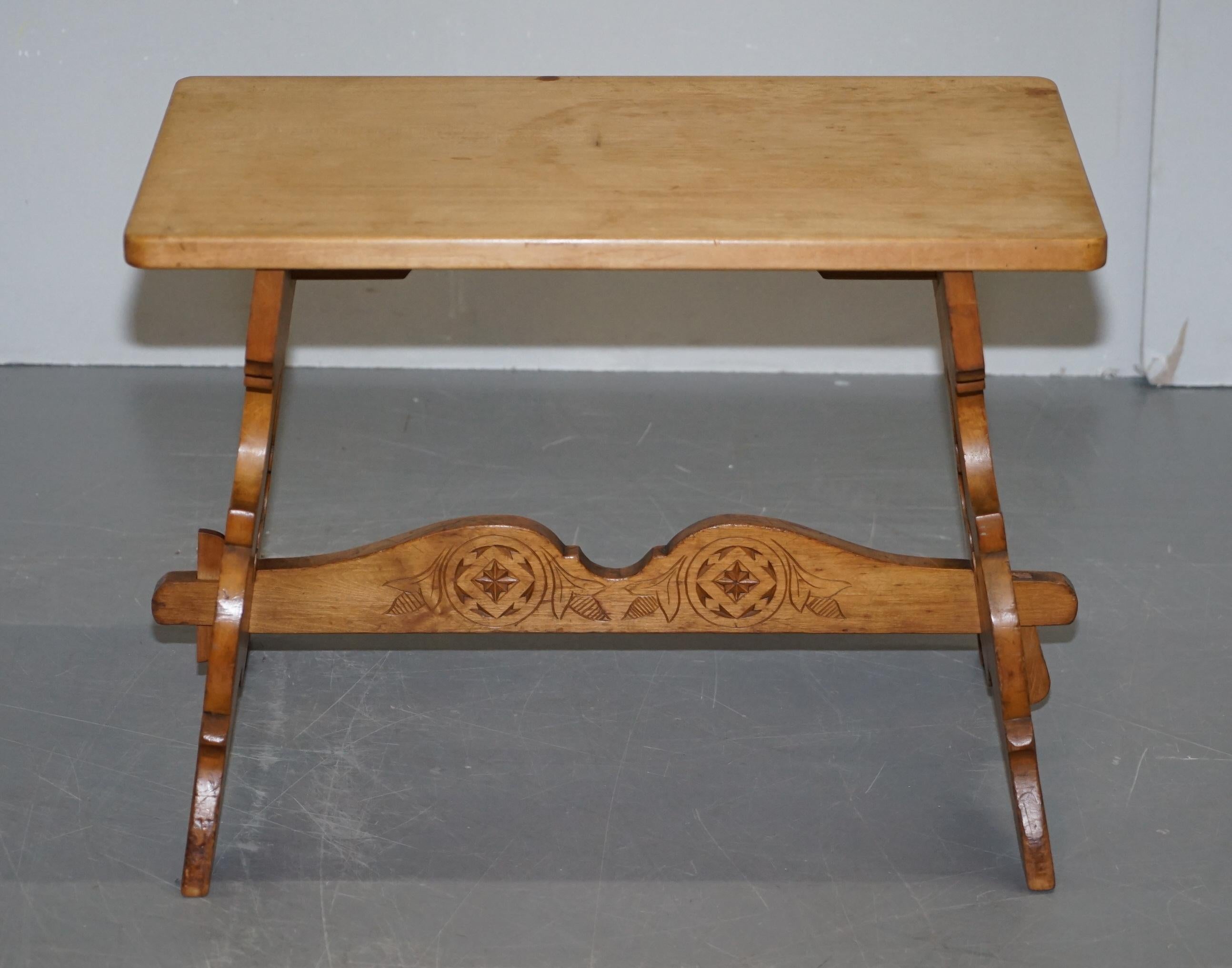 We are delighted to offer for sale this lovely circa 1930s Scottish hand carved walnut side or coffee trestle table

A good looking and well made piece, ideally suited as a compact coffee table or as a large side lamp table

It originates from