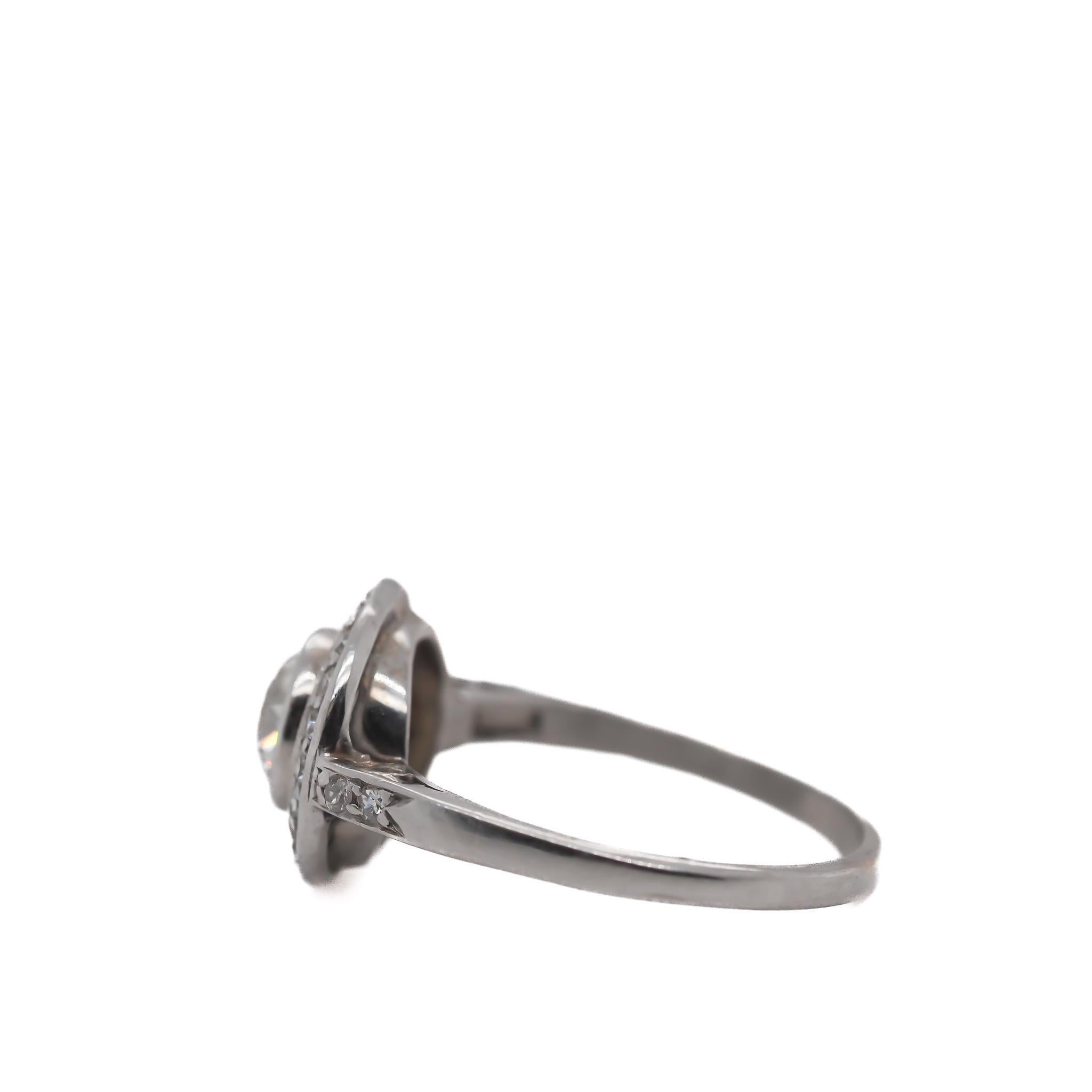 Year: 1930s

Item Details:
Ring Size: 6.75
Metal Type: Platinum [Hallmarked, and Tested]
Weight: 3.7 grams

Center Diamond Details:
Weight: 1.00ct total weight
Cut: Old European brilliant
Color: G
Clarity: VS
Type: Natural

Side Diamonds: .20ct
