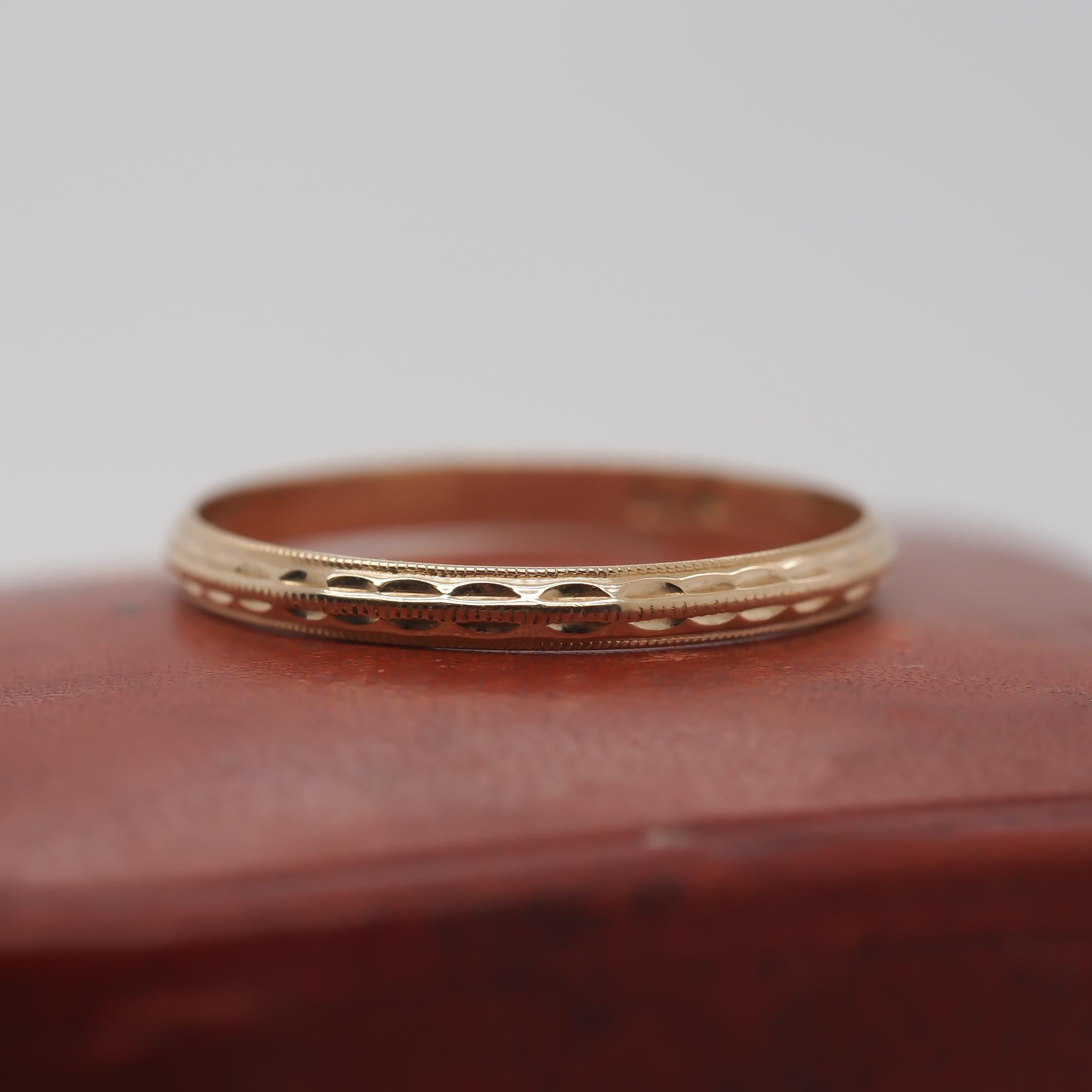 789rYear: 1930s
Item Details:
Ring Size: 5.75 (Sizable)
Metal Type: 10k yellow gold [Hallmarked, and Tested]
Weight: 1.0 grams
Band Width: 2mm
Condition: Excellent