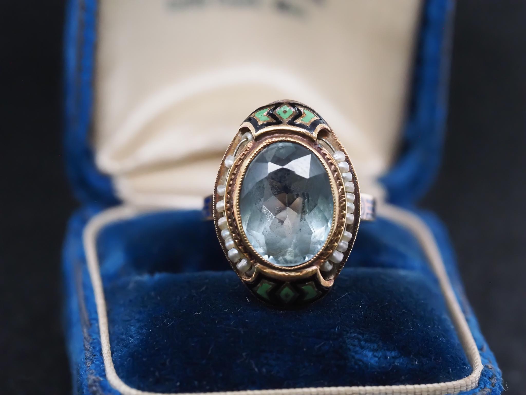 Year: 1930s
Item Details:
Ring Size:  4.5 (Sizable)
Metal Type: 14K Yellow Gold [Hallmarked, and Tested]
Weight:  5.6 grams
Center Details: Zircon, 12mm long, teal blue color.
Band Width: 2mm
Condition:  Excellent
