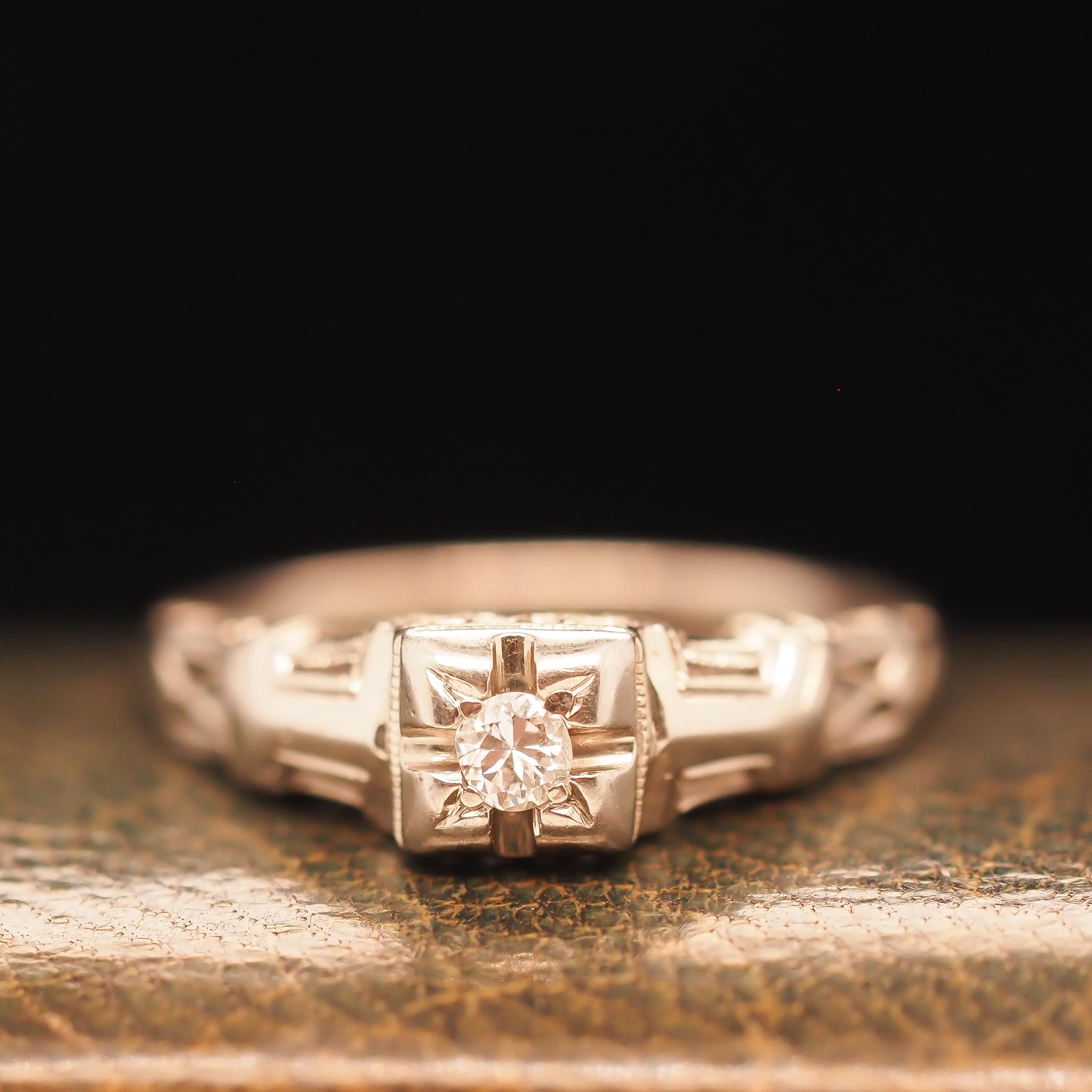 Year: 1930s
Item Details:
Ring Size: 6.5 (Sizable)
Metal Type: 18K White Gold[Hallmarked, and Tested]
Weight: 2.5 grams
Diamond Details: .08ct, Old European Brilliant, G color, VS Clarity
Side Stone Details:
Band Width: 1.7mm
Condition: