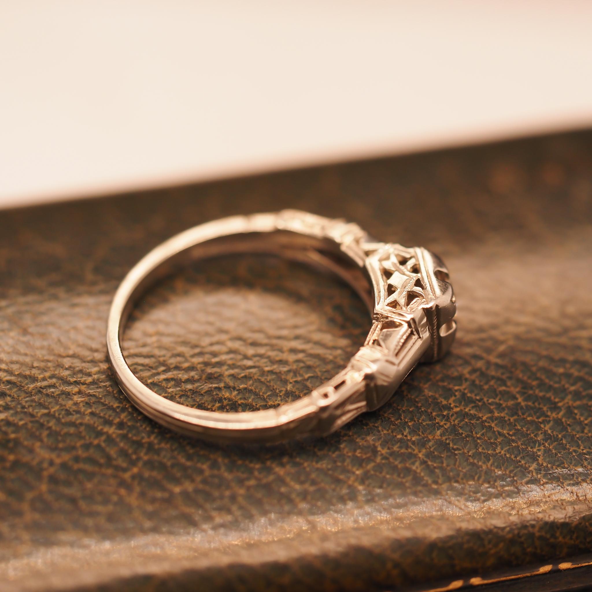 Circa 1930s 18K White Gold “Romance” Diamond Filigree Ring In Good Condition For Sale In Hicksville, NY