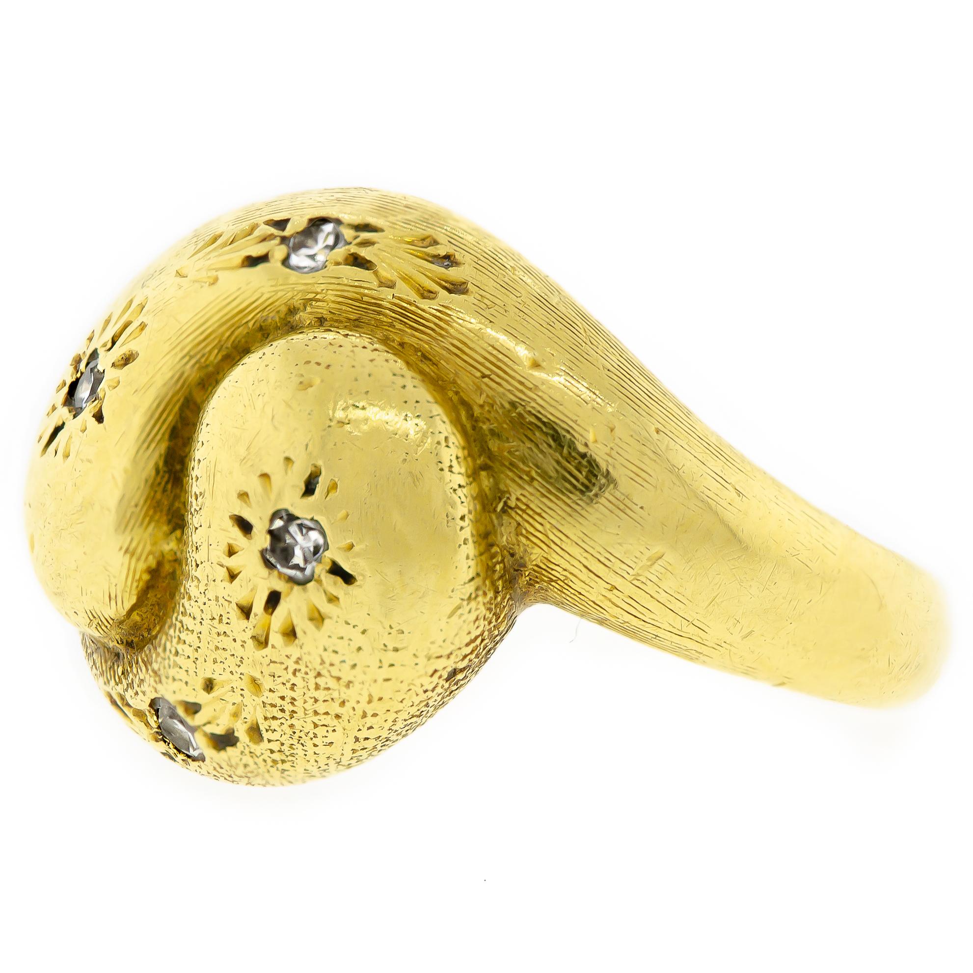 Sharp circa 1930s diamond and 18kt yellow gold double snake ring. This striking ring contains 4 small sparkling single-cut diamonds set into a star-cut pattern on the face of the modified double snake ring. Lovely elegant engraved details cover this