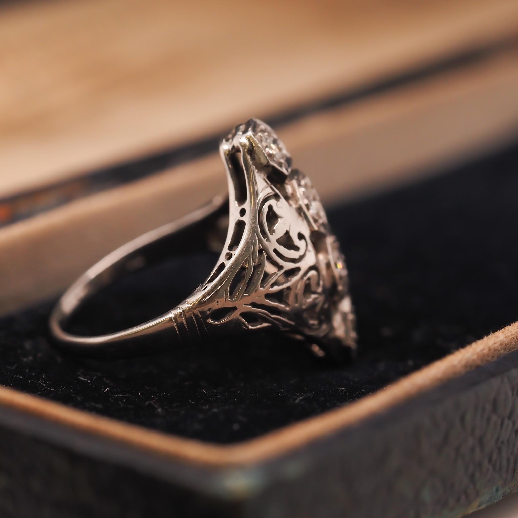 Year: 1930s
Item Details:
Ring Size: 6.25 (Sizable)
Metal Type: 18K White Gold [Hallmarked, and Tested]
Weight: 4.0 grams
Diamond Details: .35ct total weight, old European brilliant cut, G Color, VS Clarity
Band Width: 1.8mm
Condition: