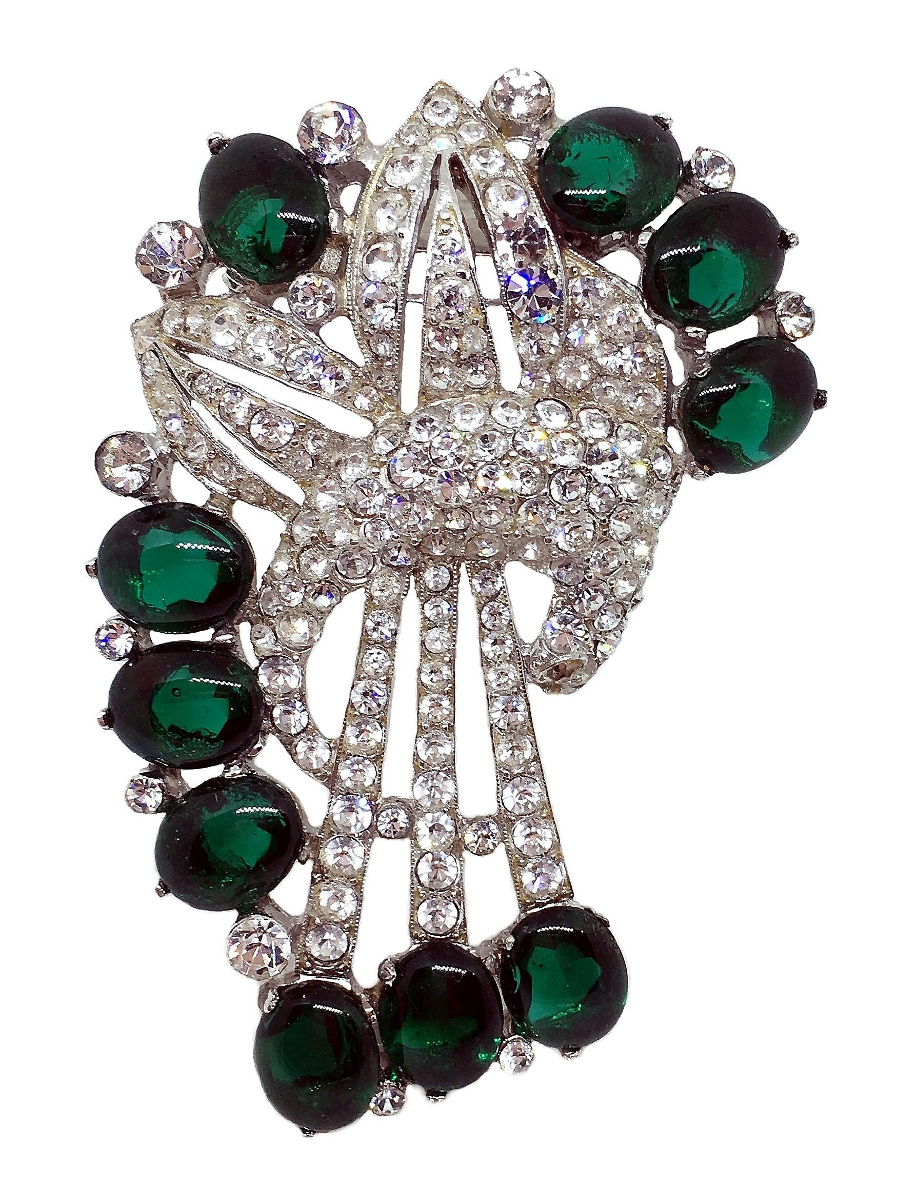 1930s Coro rhodium plated brooch/fur clip prong set with clear, dazzling rhinestones and emerald green glass oval cabochons.  Definitely a statement piece, it measures 2.86