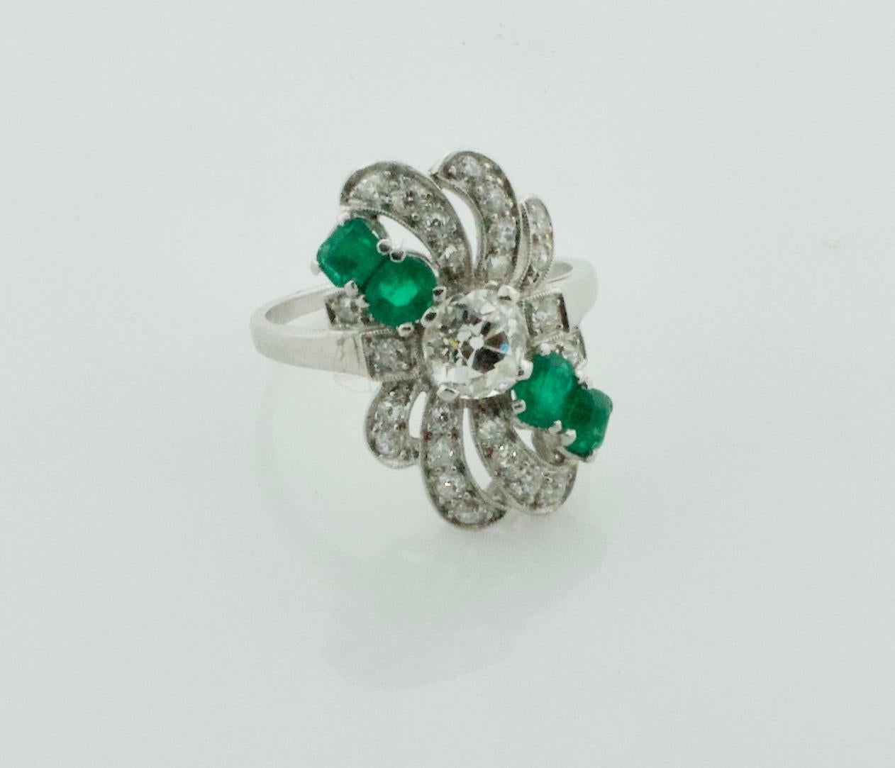 Circa 1930's Diamond and Emerald Ring in Platinum
One Old Mine Cut Diamond weighing .50 carats approximately [Near Colorless and Si1 no imperfections visible to the naked eye]
Four Cushion Cut Emeralds weighing .50 carats approximately
Twenty Four
