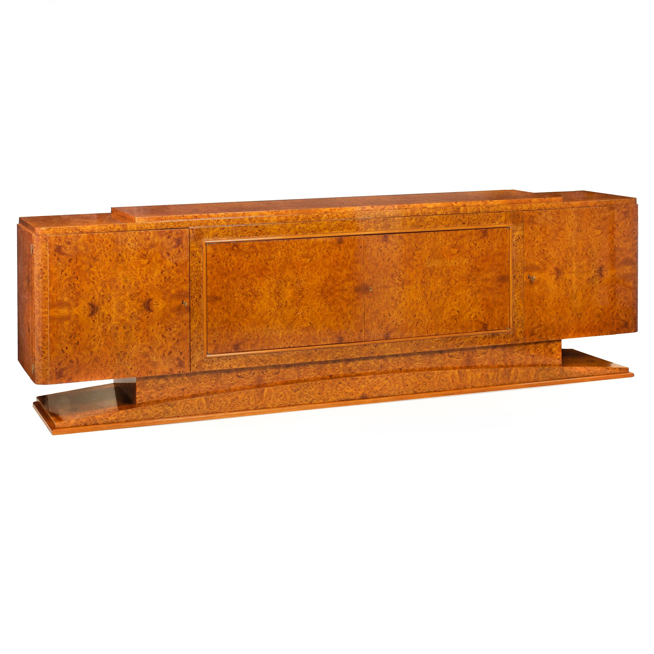 MONUMENTAL ART DECO BURL OLIVEWOOD CREDENZA CABINET
France  circa 1930s
Item # 111LTW03P

An innovative creation from the Art Deco period circa the 1930s, the cabinet was ingeniously designed to break down into manageable parts for ease of transit: