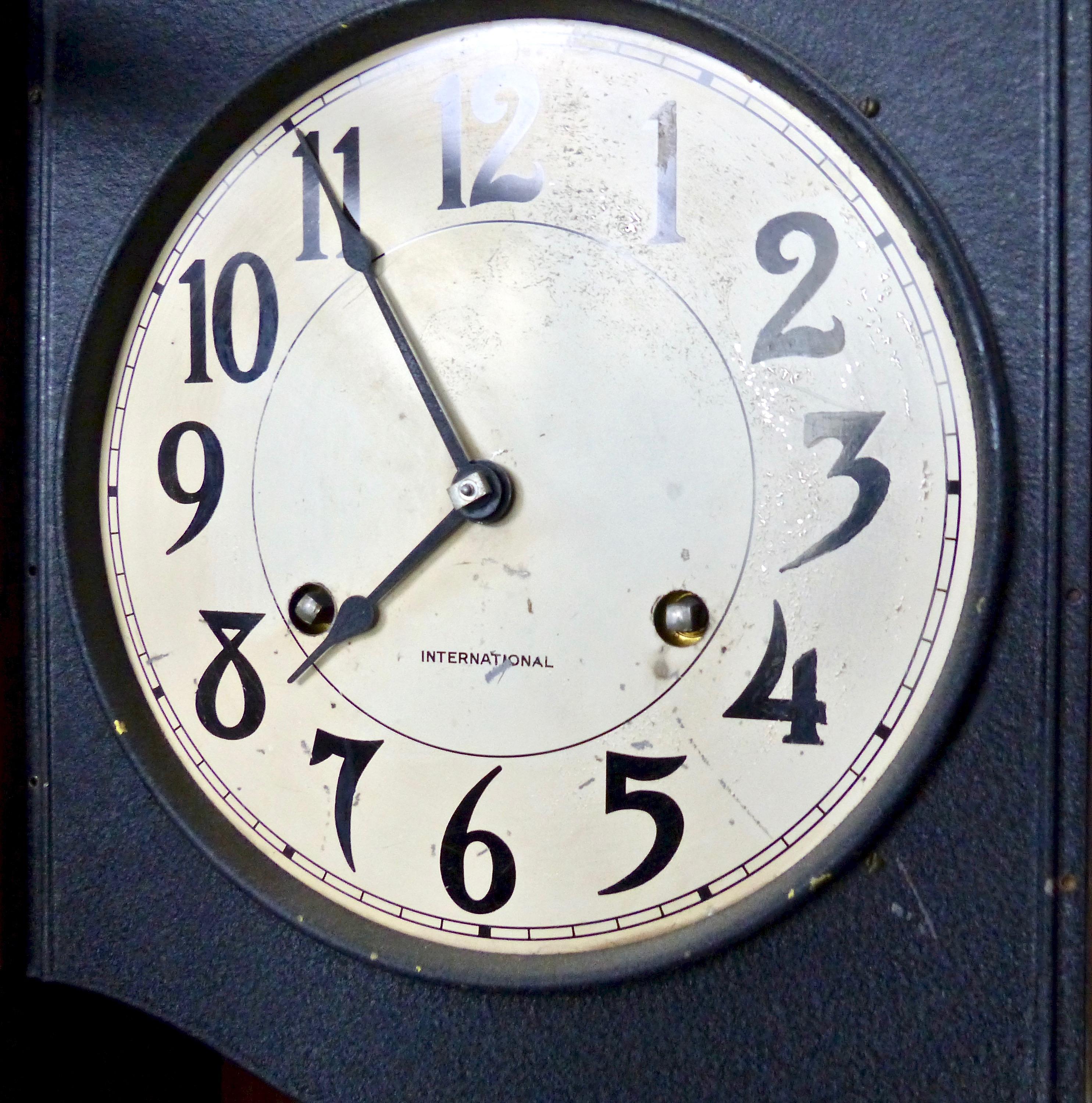 An oakwood cabinet clock, made by International Business Machines (IBM) in the 1930s. Interior pendulum.
Dimensions: 36” H x 15.5” W x 9” D.