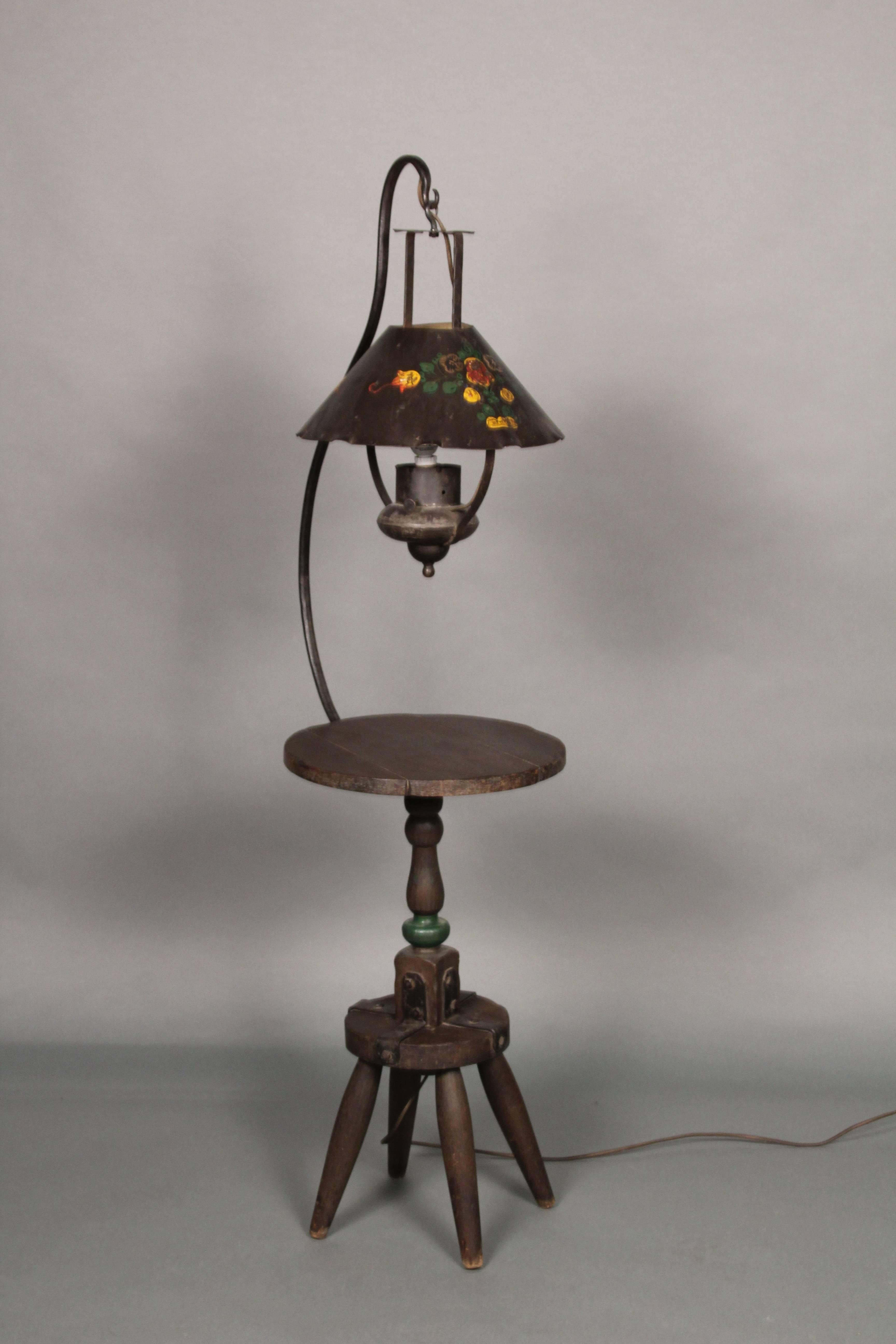 Monterey old wood tabletop floor lamp with milk stool base, circa 1930s. Iron strapping. Floral painted iron shade. Polychrome paint on base.