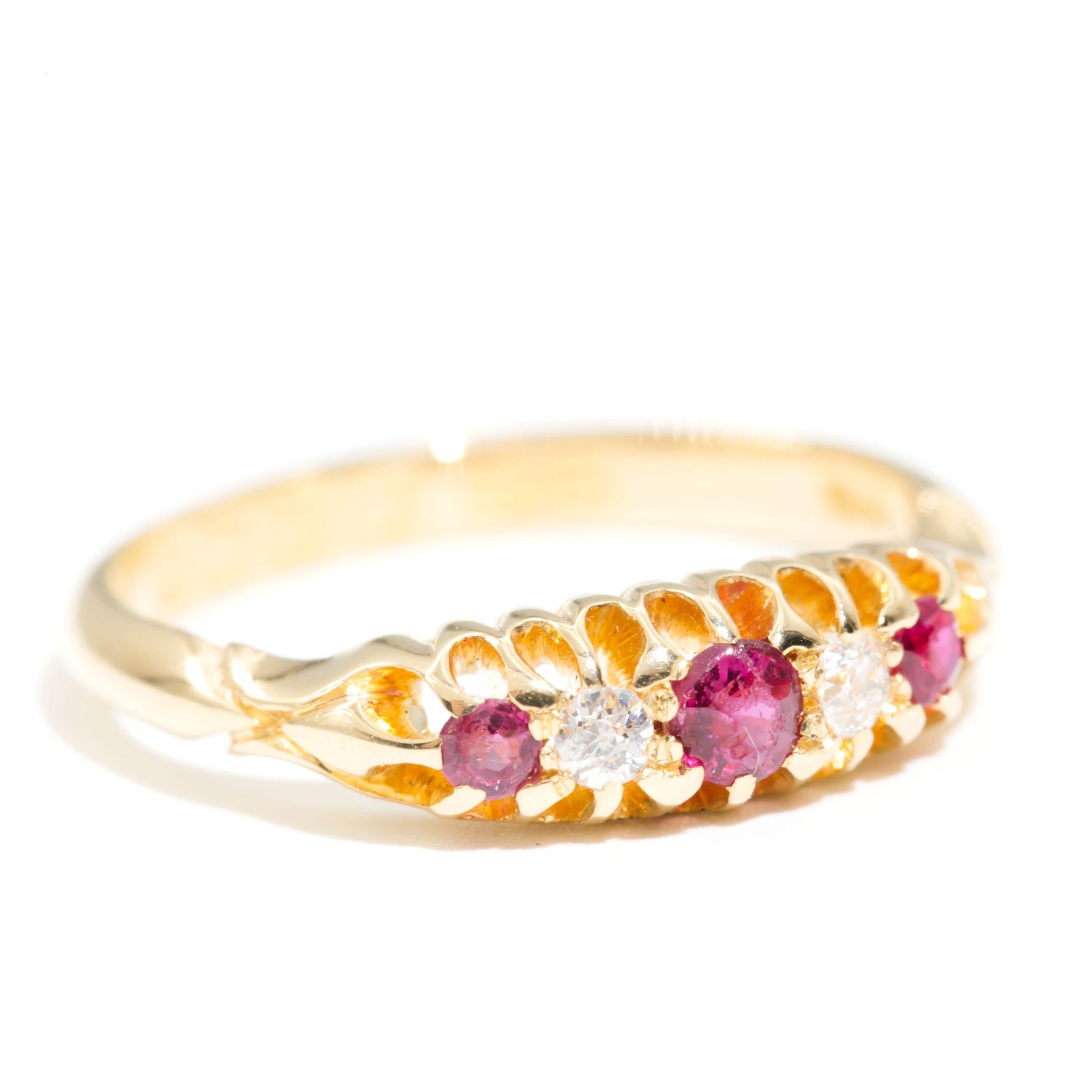 Carefully crafted in 18 carat yellow gold is this charming antique band ring, Circa 1930s, delicately set with three round rubies alternating with two old European cut diamonds. We have named this gorgeous vintage splendour The Flossie Ring. The