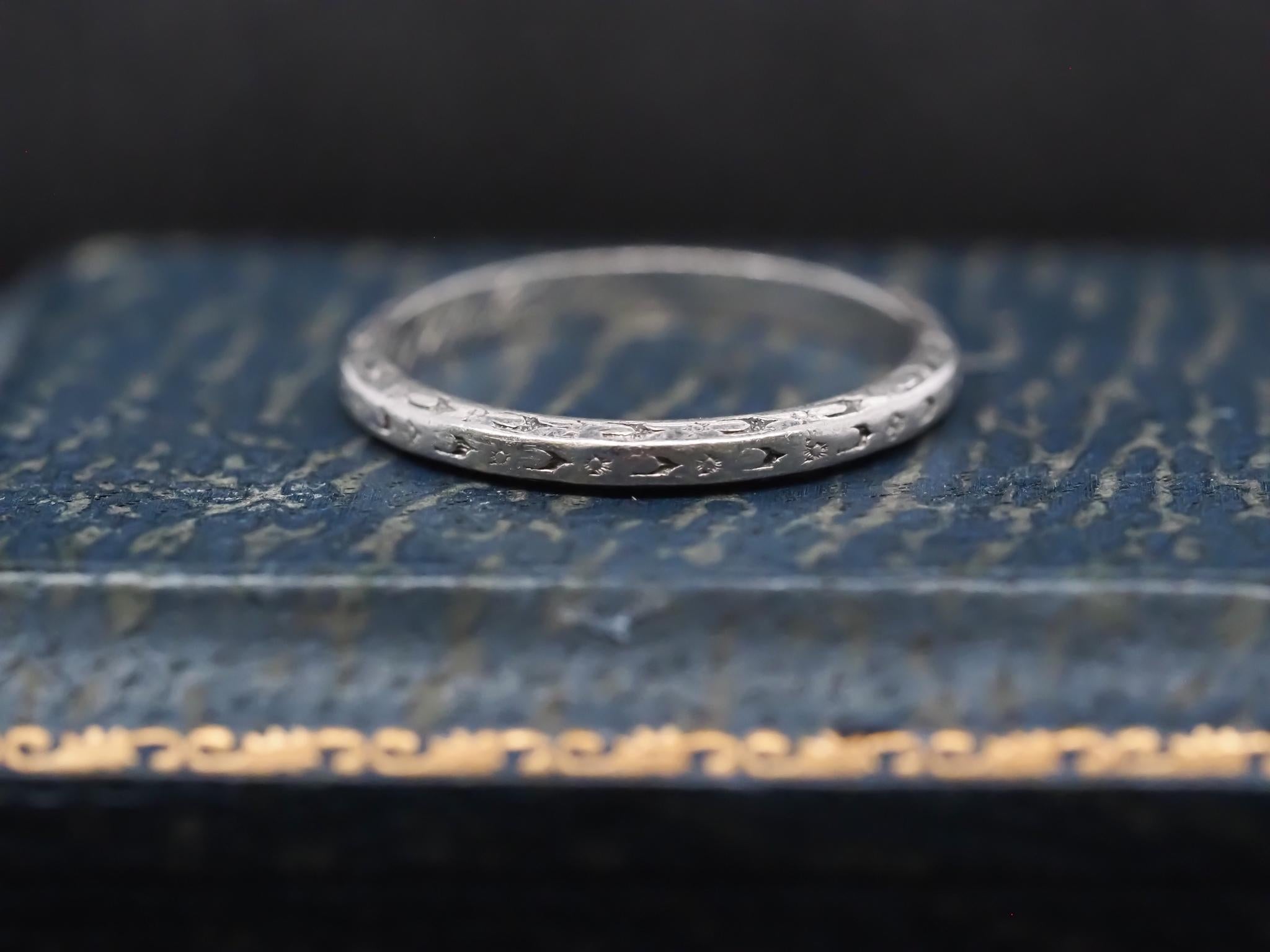 Year: 1930s
Maker: Orange Blossom
Item Details:
Ring Size: 5.25 (Sizable)
Metal Type: Platinum  [Hallmarked, and Tested]
Weight: 2.5  grams
Band Width: 2.1
Condition:  Excellent